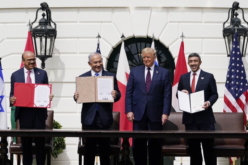 Bahrain's Khalid bin Ahmed Al Khalifa, Israel's Benjamin Netanyahu, America's Donald Trump, and UAE's Abdullah bin Zayed al-Nahyan, with the signed accords. Photo / AP 