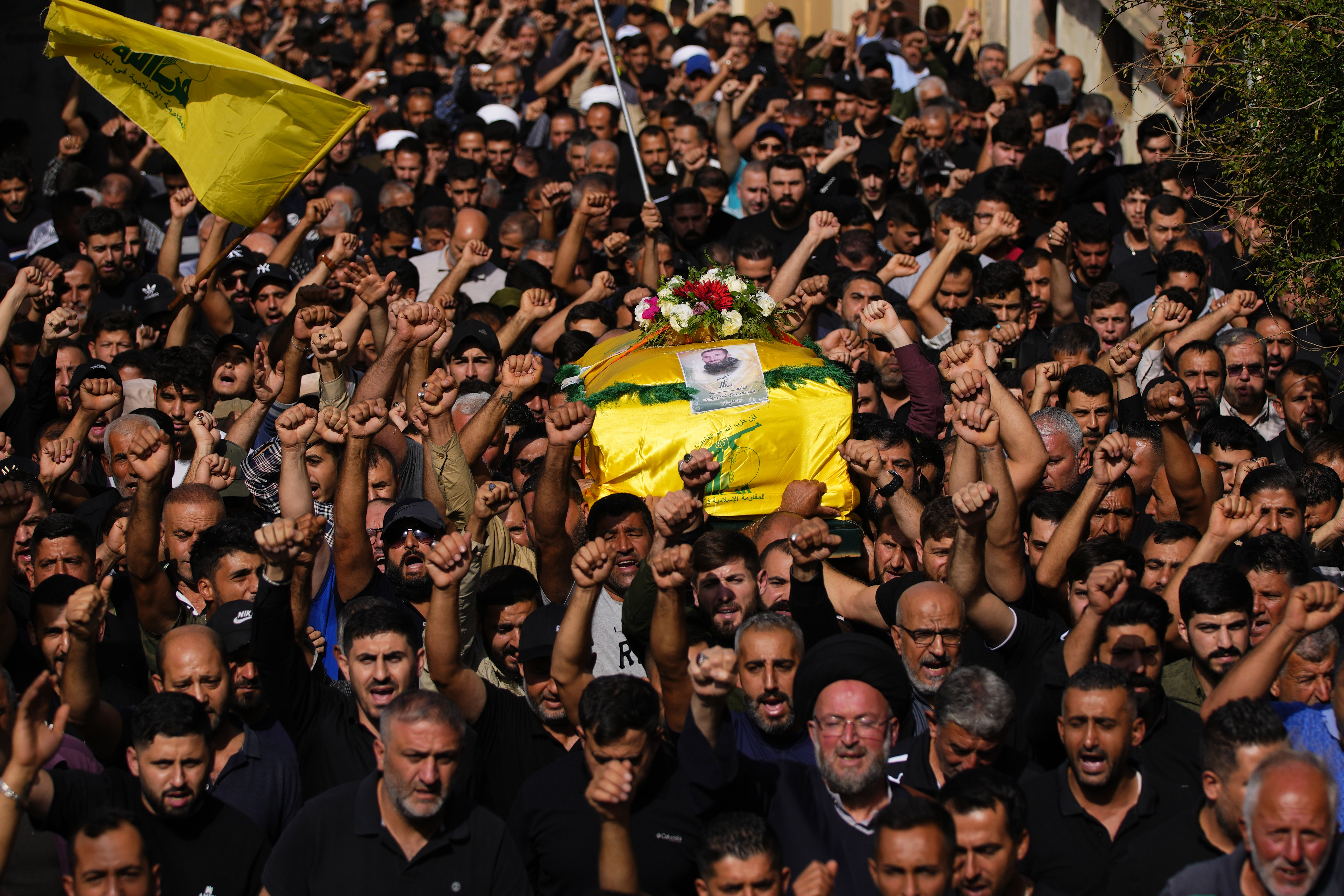 People carry the coffin of Hezbollah fighter, Bilal Nemr Rmeiti, who was killed by Israeli shelling, during his funeral procession in Majadel village. Photo / AP