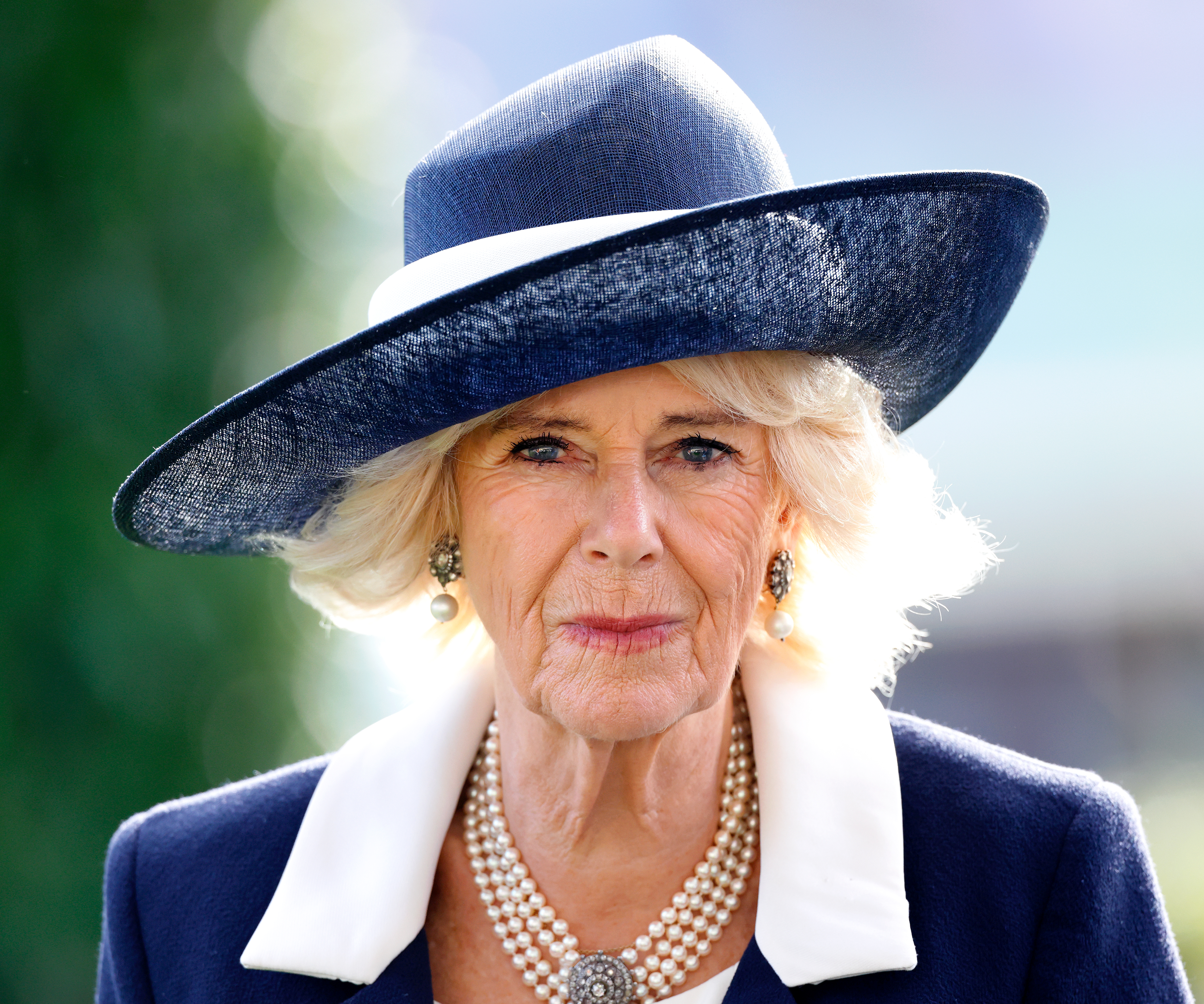 The Queen has been left solo — but her unique sense of humour, voracious reading and sartorial choices are helping her hold the fort. Photo / Getty Images