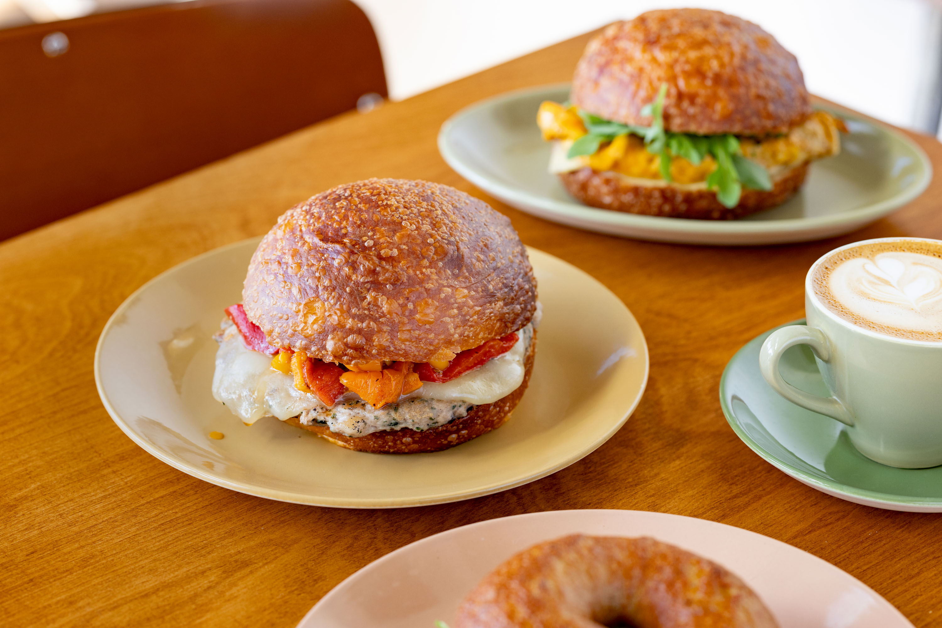 Good Boy sandwiches, including the sausage with peppers and provolone, and the breakfast sandwich with egg, Swiss cheese and rocket, both on sourdough brioche. Photo / Babiche Martens