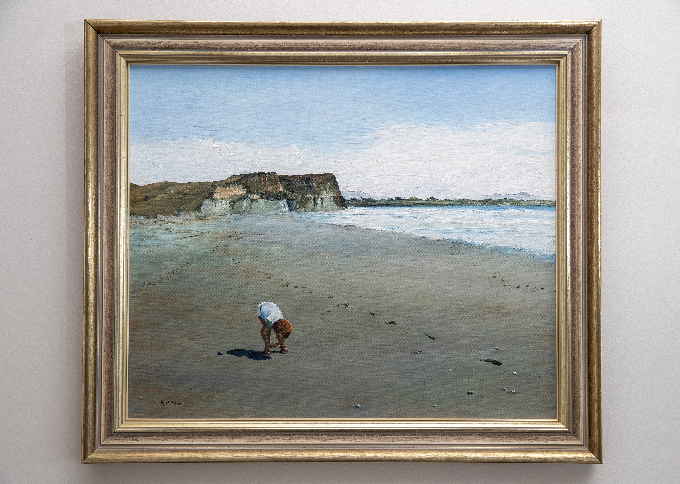 An oil painting of Chris Hipkins as a boy on a Taranaki beach. Photo / Mark Mitchell