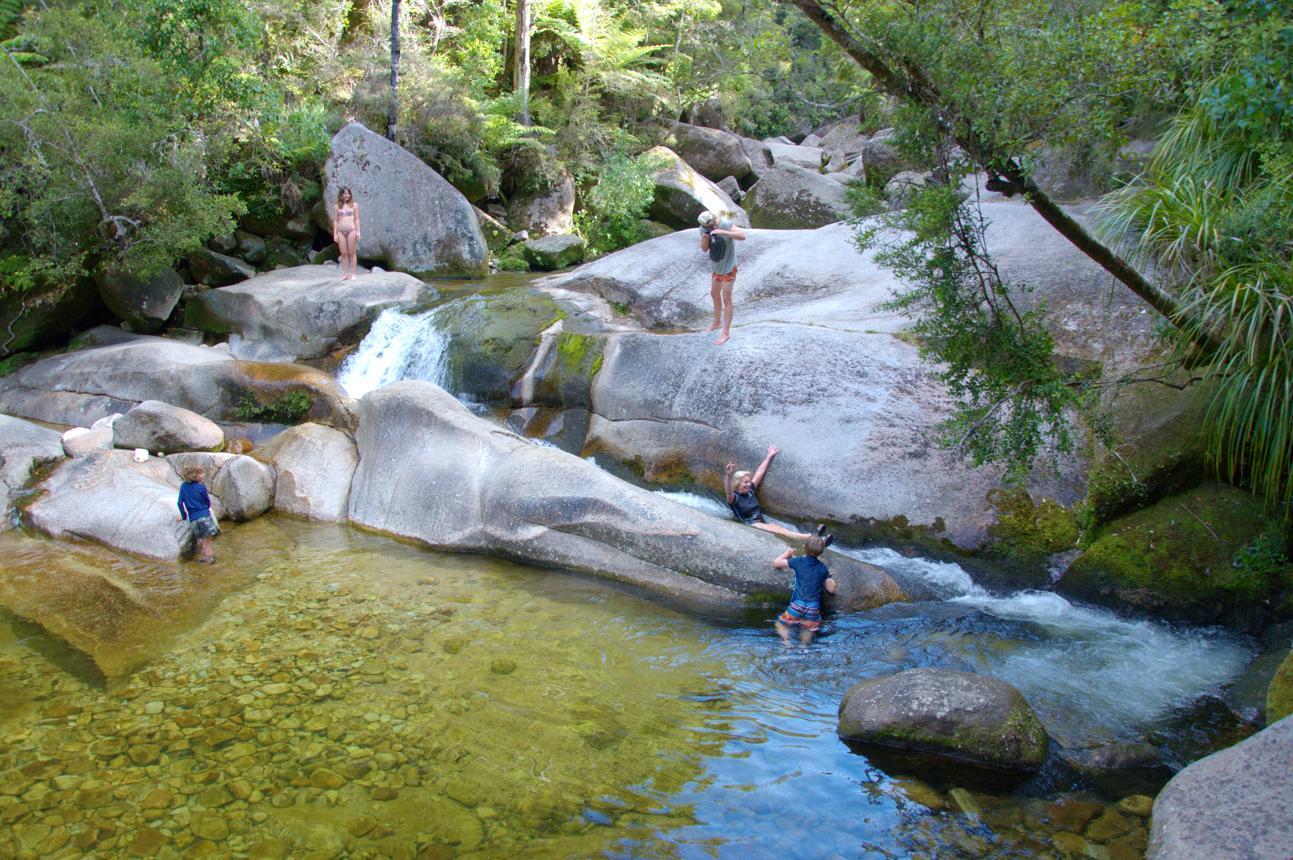 Slide down a moss-lined natural water slide into crystal clear pools at Cleopatra's Pools. Photo / Wilsons Abel Tasman 