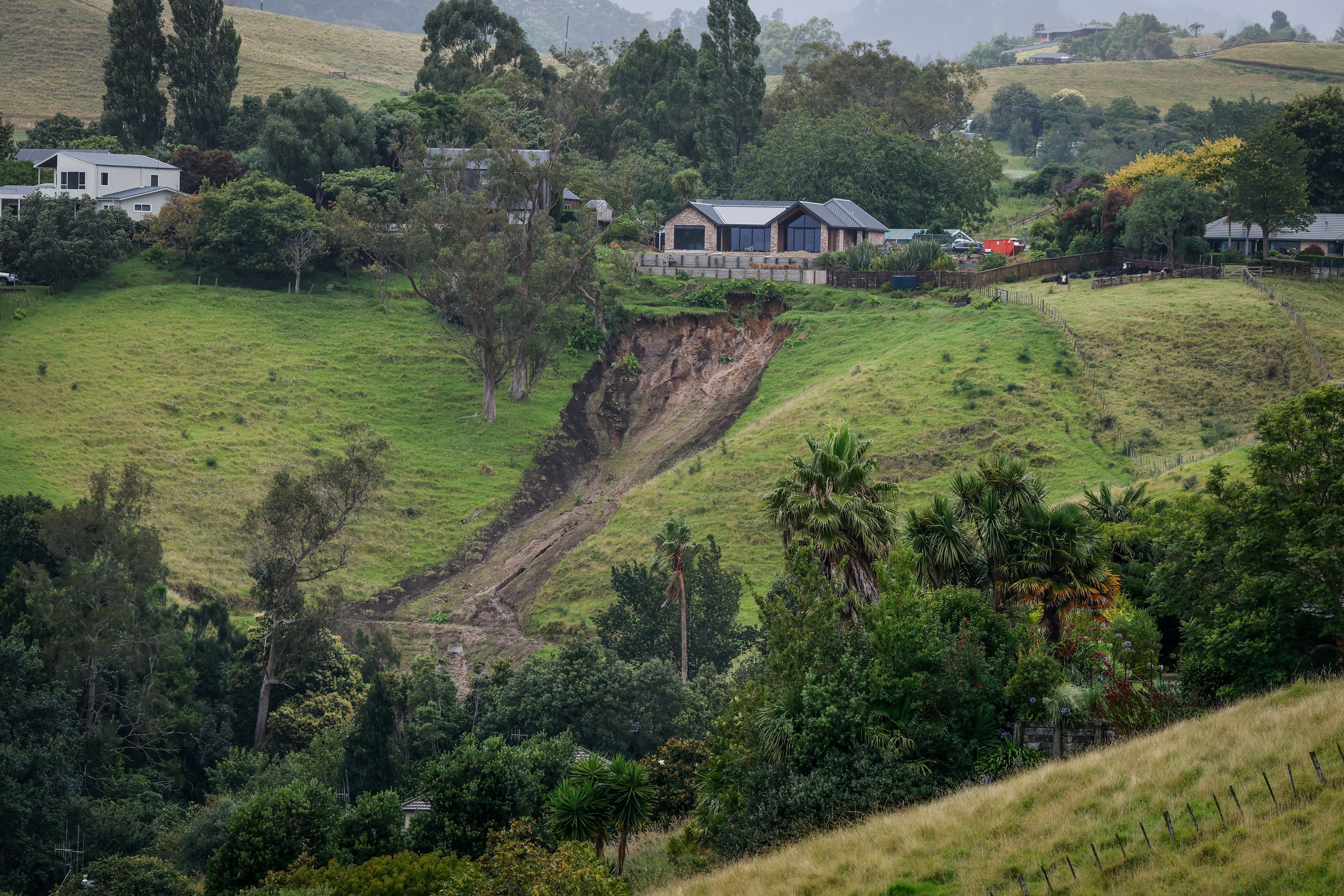 A slip has narrowly missed a new build home in the Tauranga suburb of Welcome Bay, viewed from Te Auhi Reserve. NZ Herald photo by Michael Craig