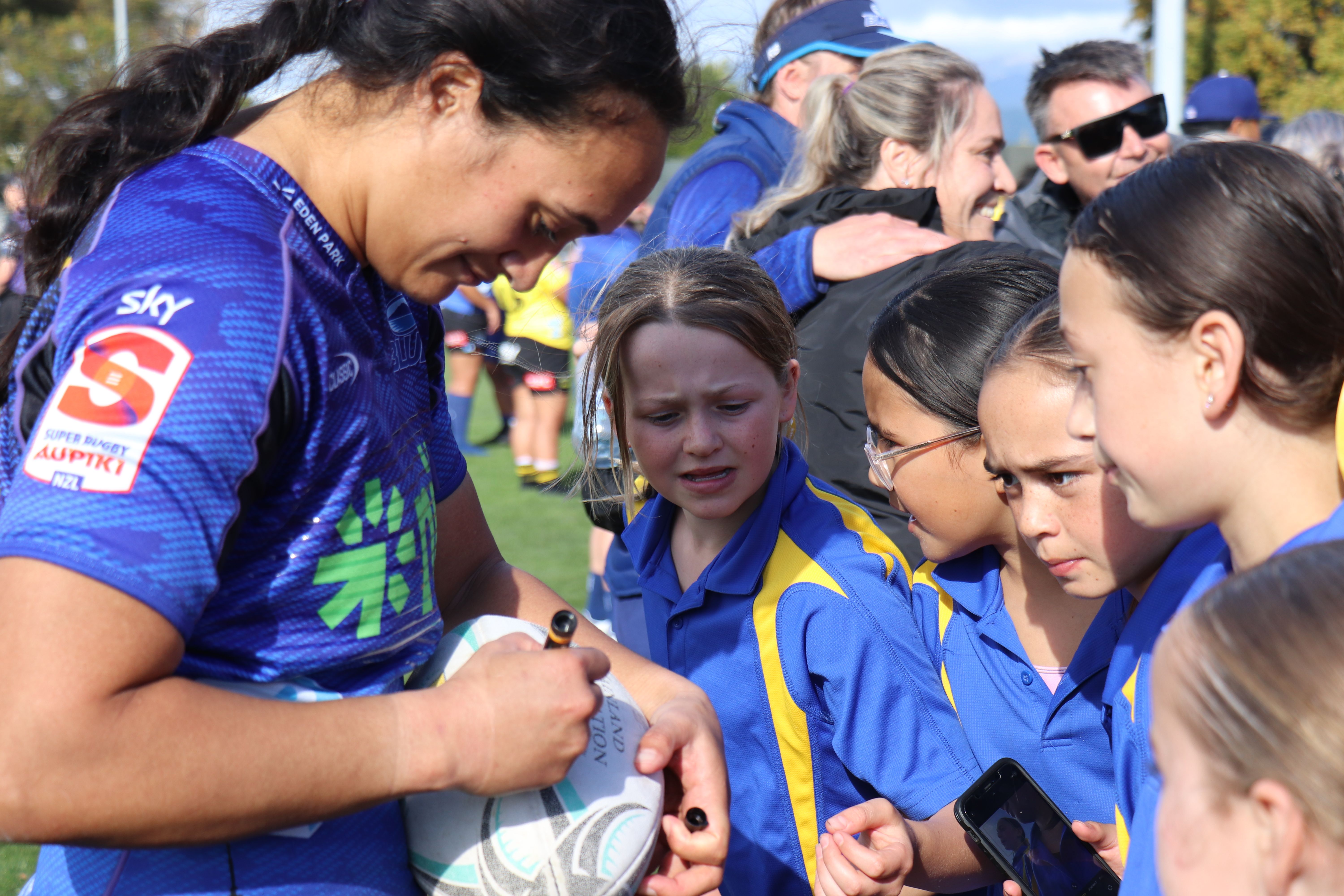Blues captain Ruahei Demant signs a ball after the match against Hurricanes Poua at Levin Domain.