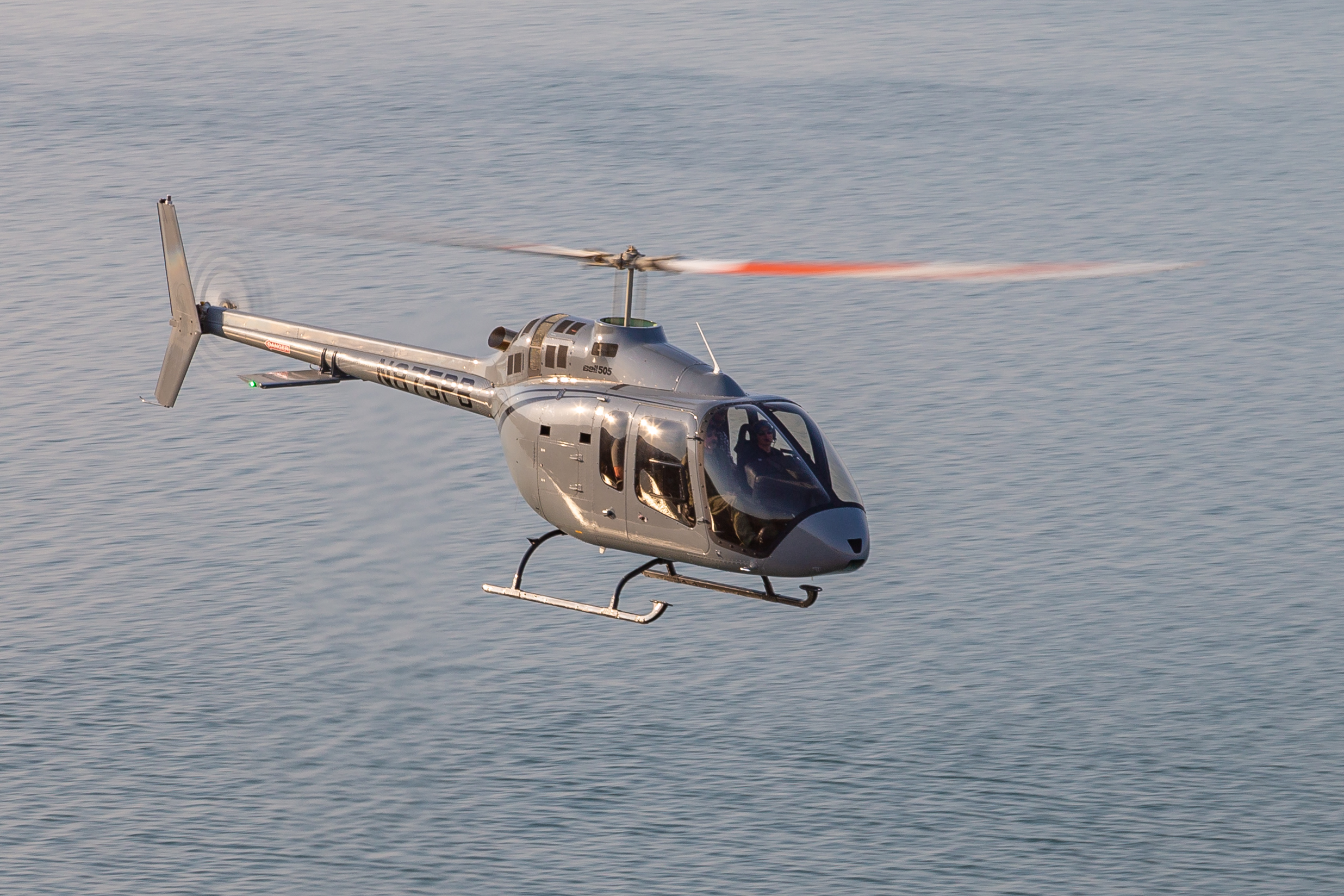 A Bell 505, typically used for business travel, military training, policing or as a utility helicopter.