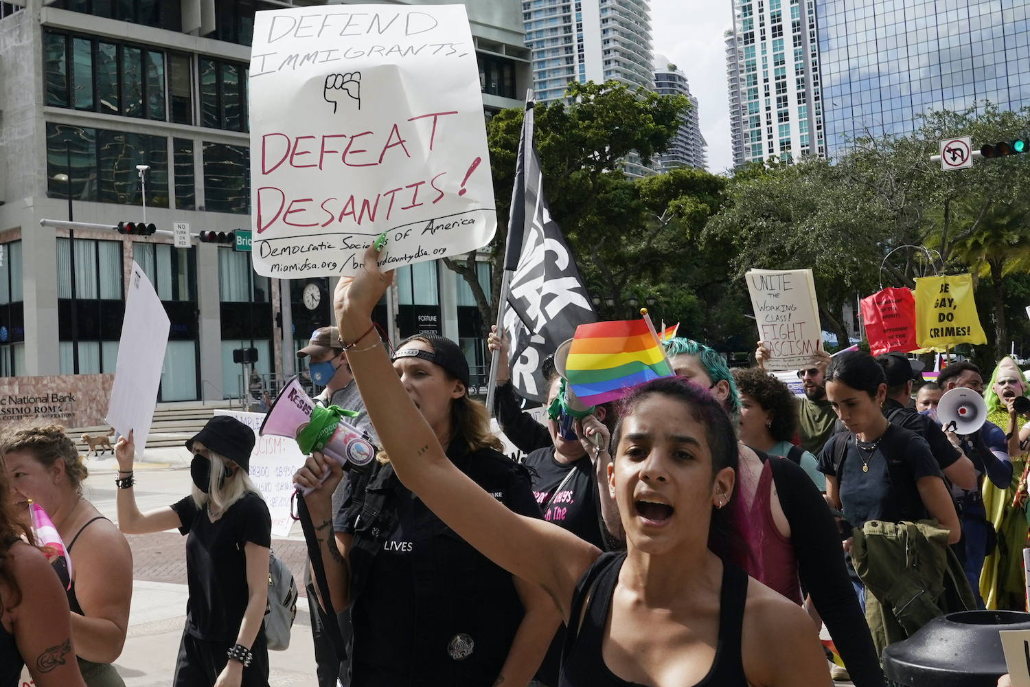 Protesters march near the hotel where Florida Governor Ron DeSantis met with donors in Miami. Photo / AP