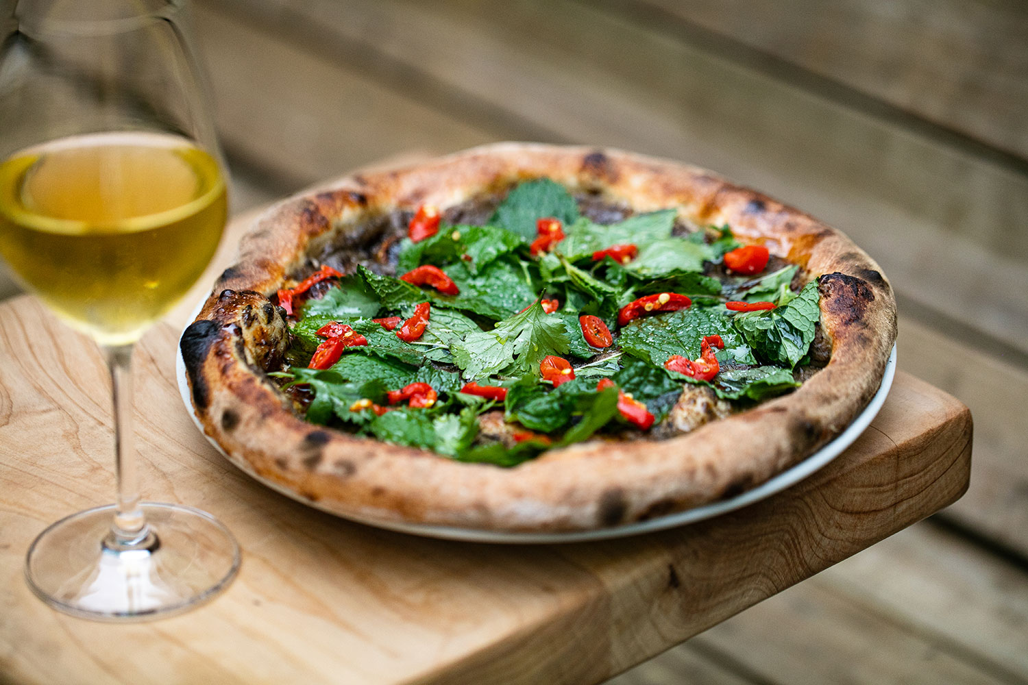 The aubergine, pickled chilli, mint and coriander pizza. Photo / Babiche Martens 