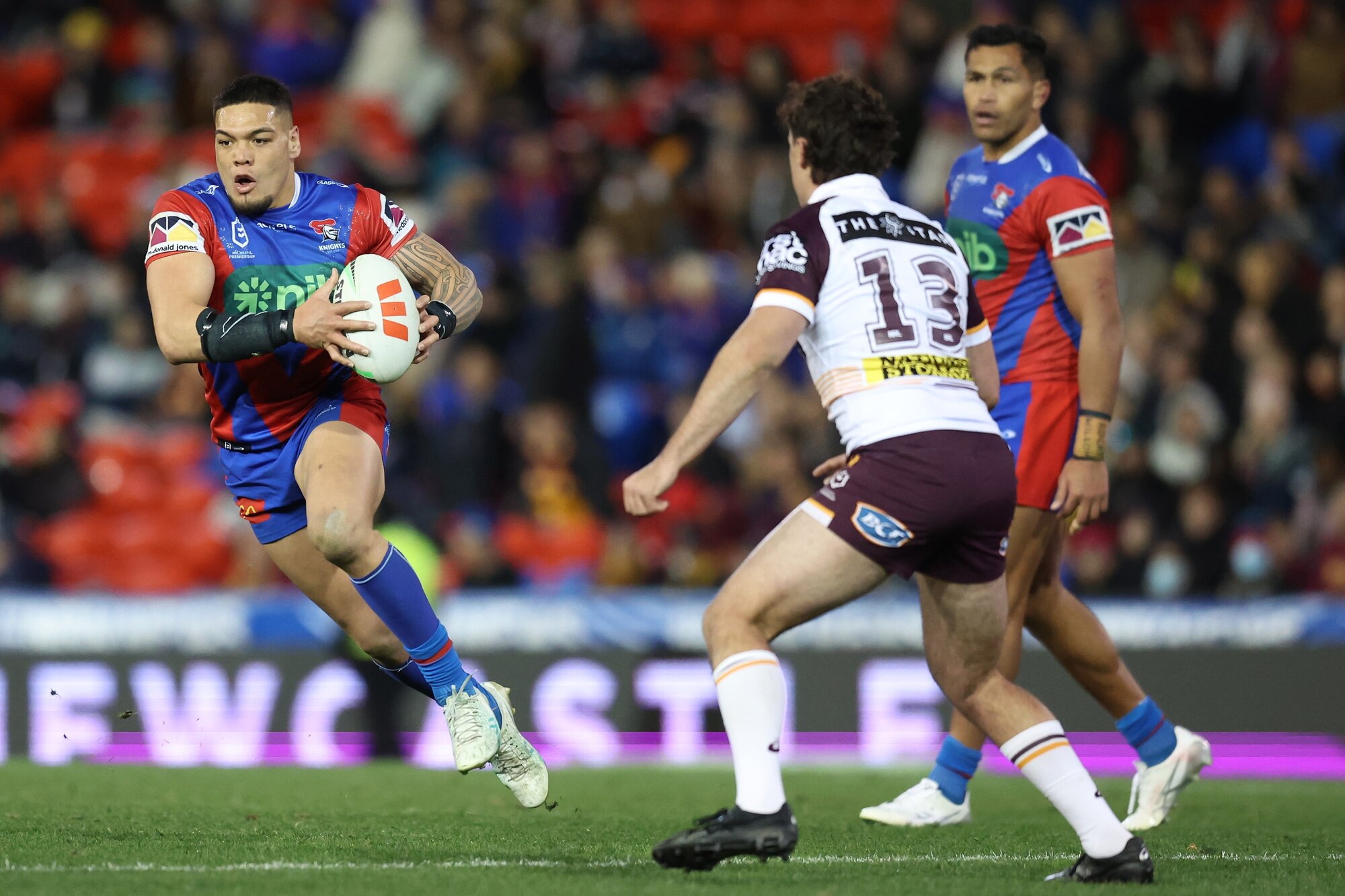 Leo Thompson carts the ball up for the Knights against the Broncos last year. Photo / Getty Images