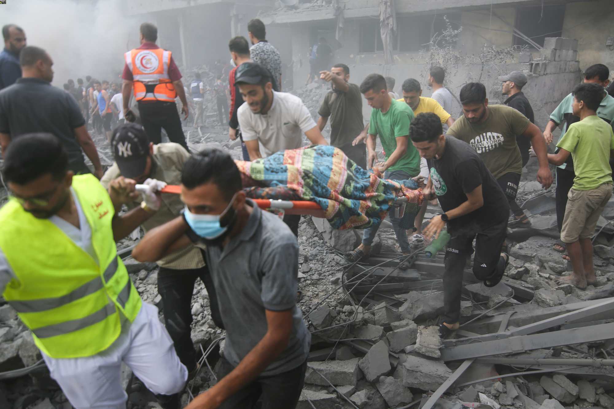 Palestinians evacuate wounded after an Israeli airstrike in Rafah refugee camp, southern Gaza Strip on October 12. Photo / AP