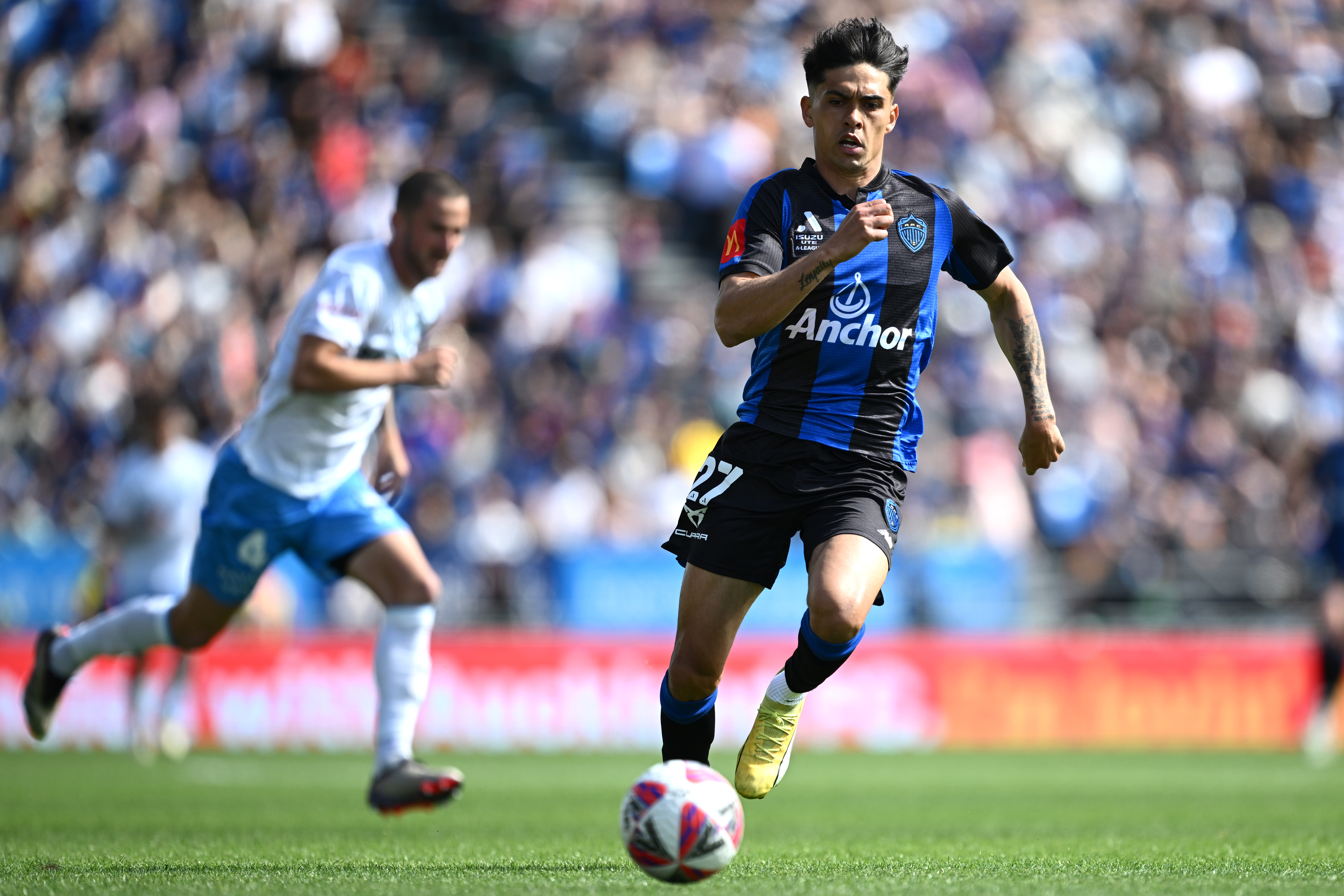 Logan Rogerson makes a break against Sydney FC. Photo / Getty Images