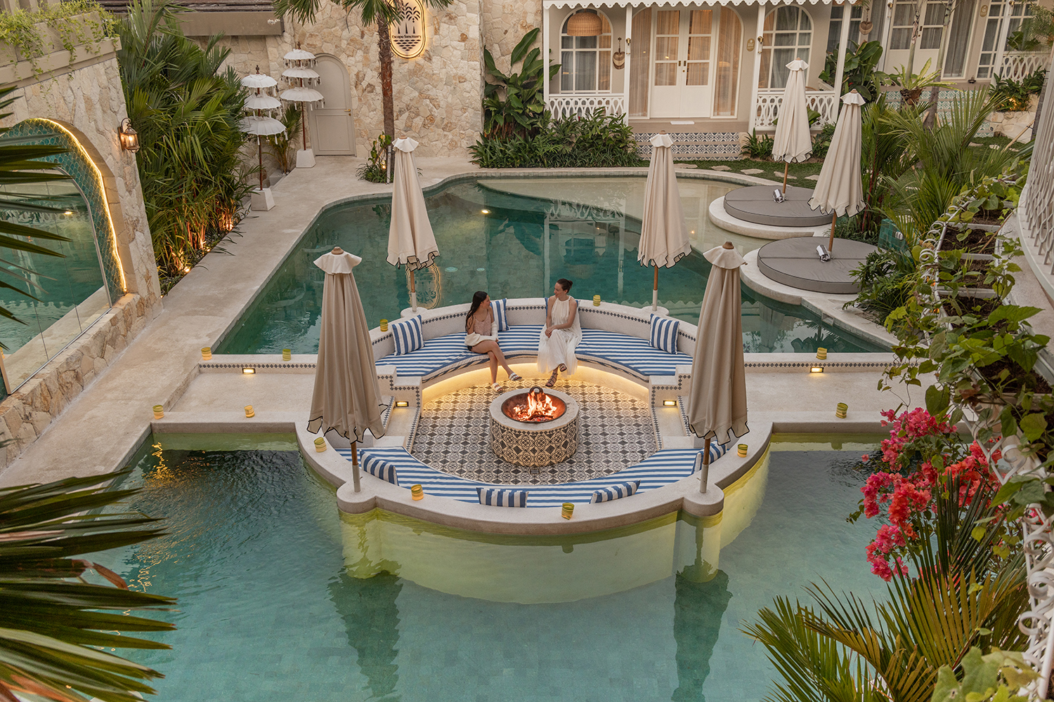 At Escape Haven in Canggu, Bali, guests can sit in a sunken fire pit nestled in the resort’s swimming pool.
