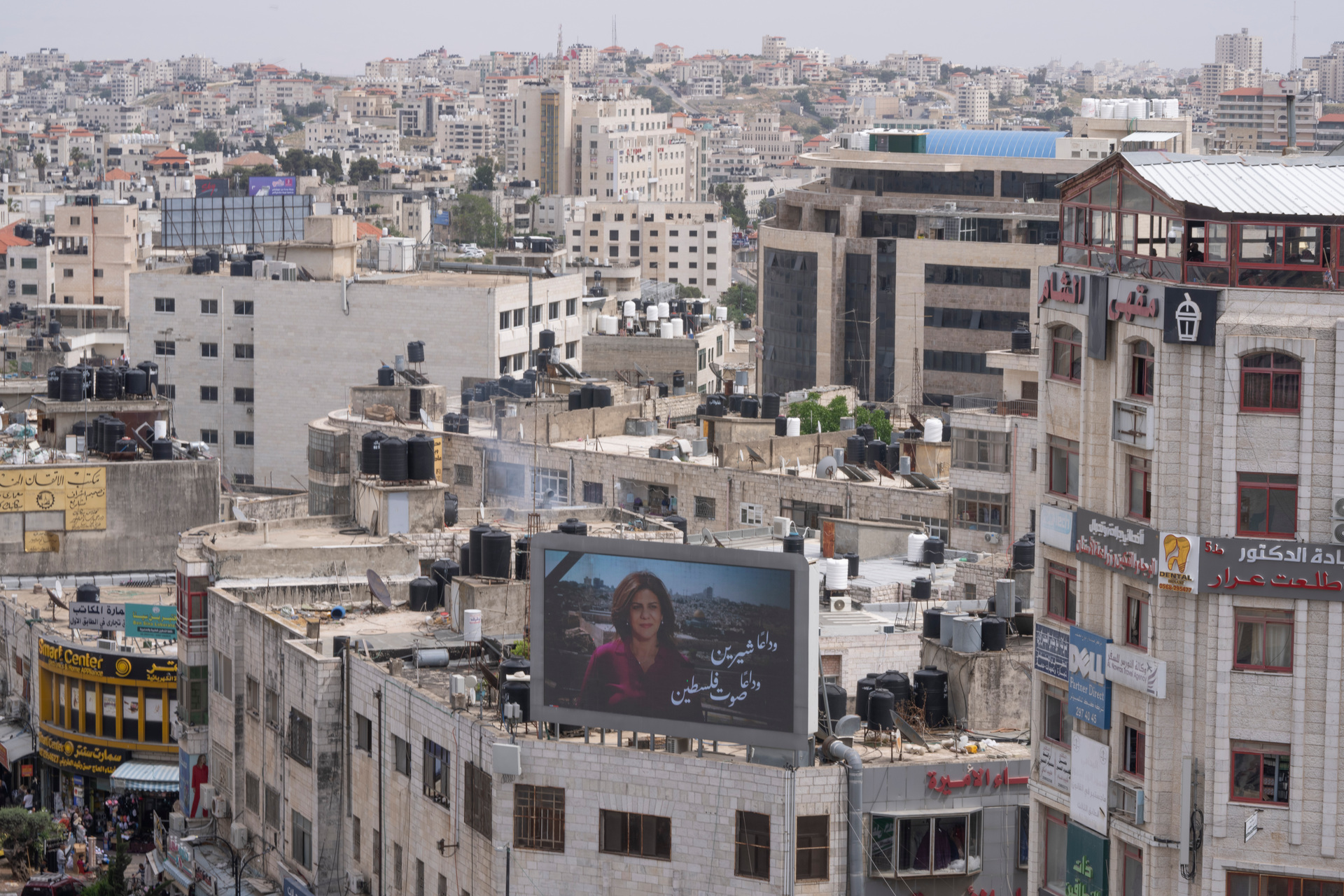 An outdoor screen in the West Bank shows a picture of Al Jazeera journalist Shireen Abu Akleh and Arabic that reads, 'goodbye Shireen, the voice of Palestine'. Photo / AP