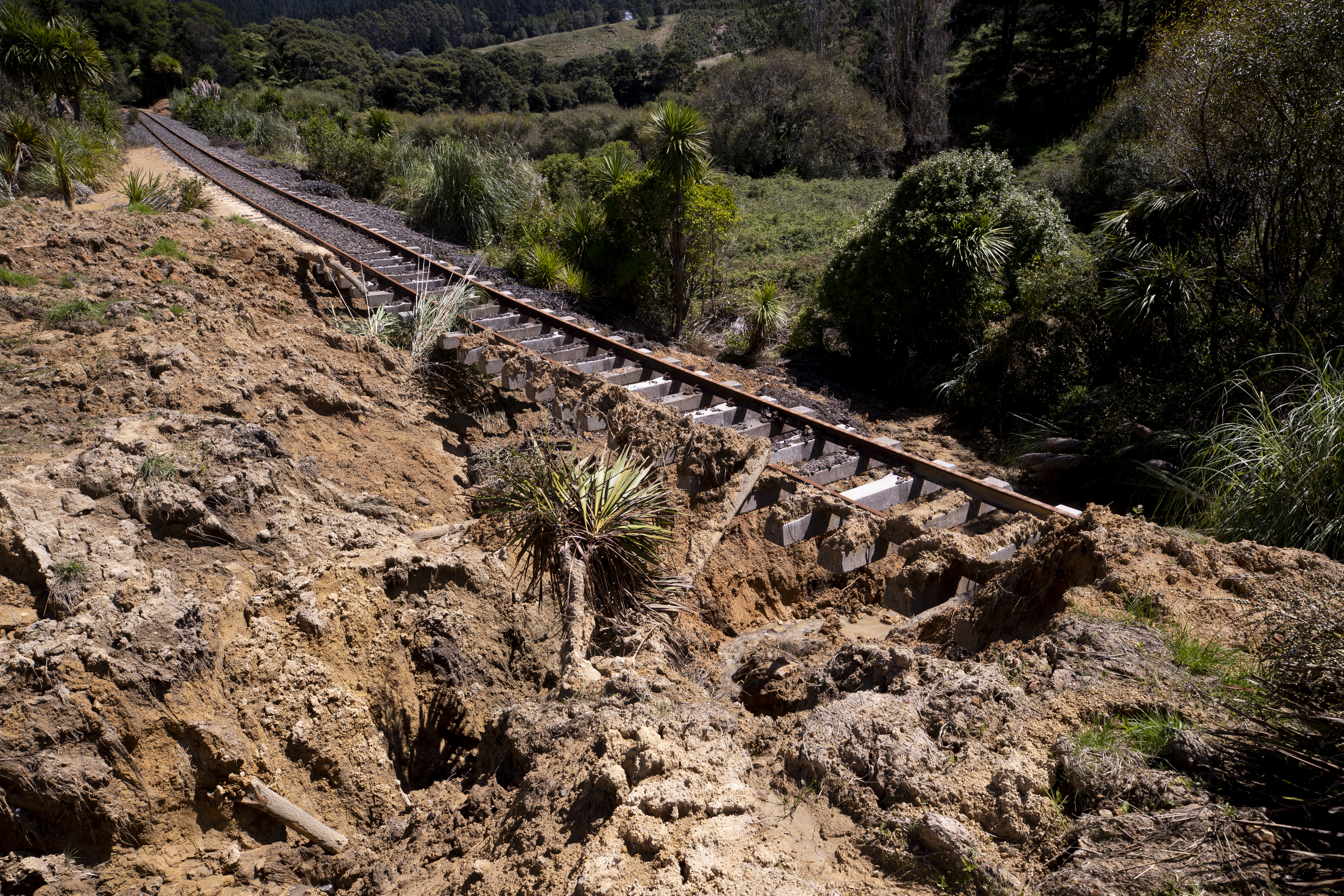 Work has started on clearing a huge slip that has blocked the North Auckland Rail Line. Photo / Dean Purcell