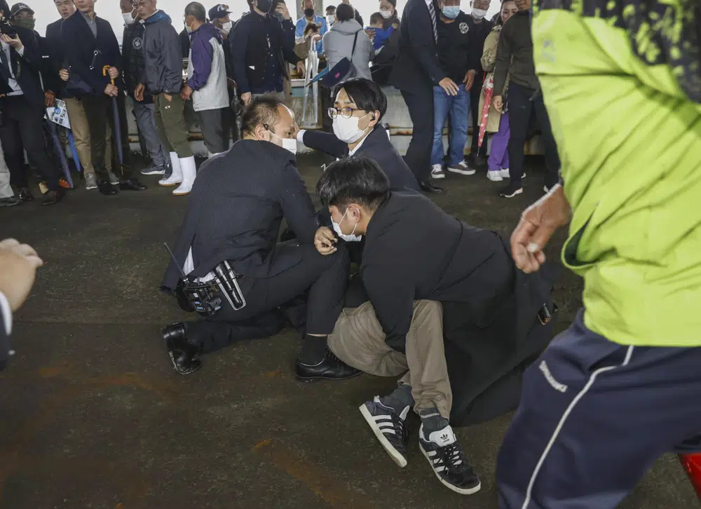 A man was caught after what appeared to be a smoke bomb was thrown at a port in Wakayama Prefecture. Photo / AP