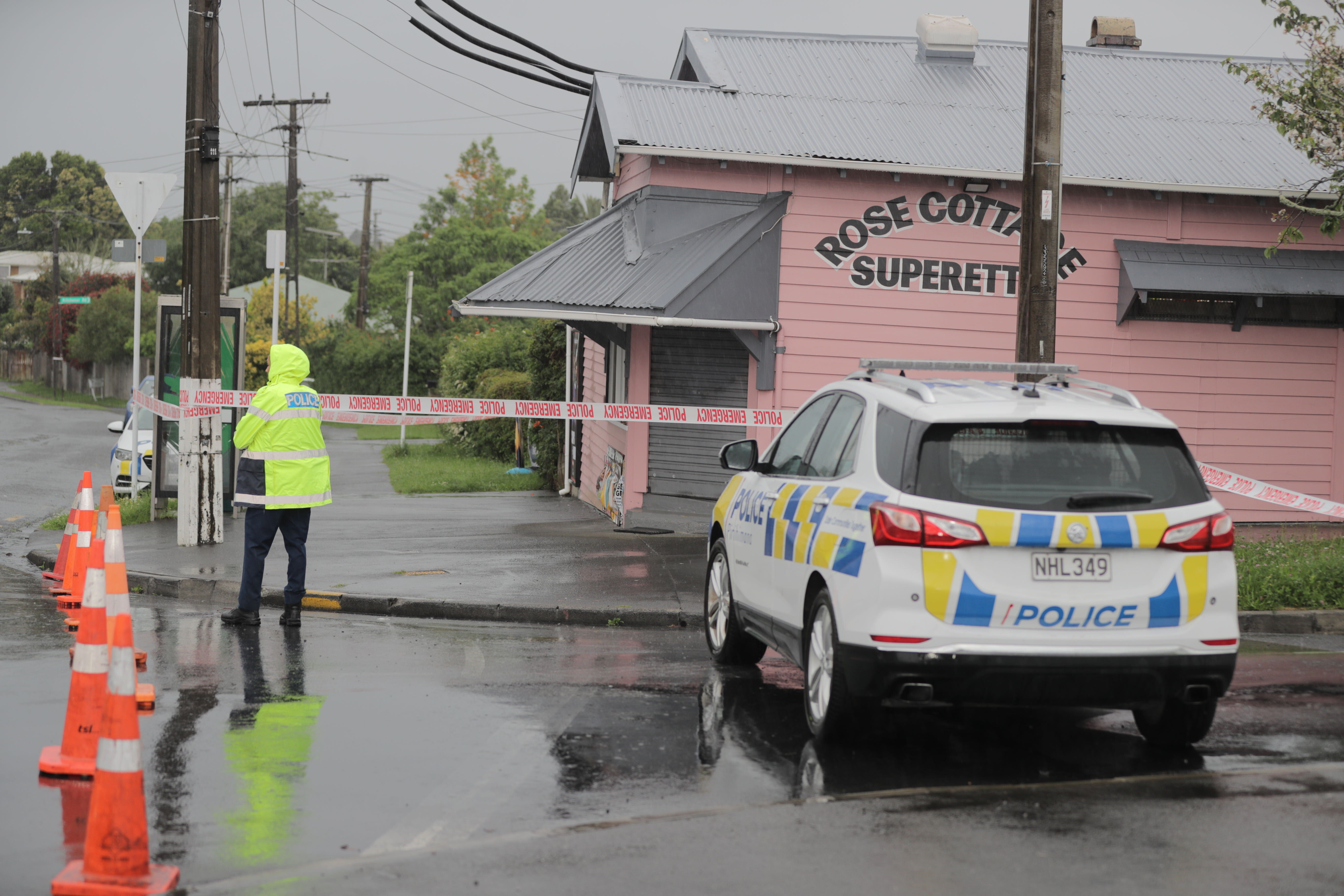 Police are at the scene after a worker at Rose Cottage Superette was fatally stabbed last night. Photo / Michael Craig