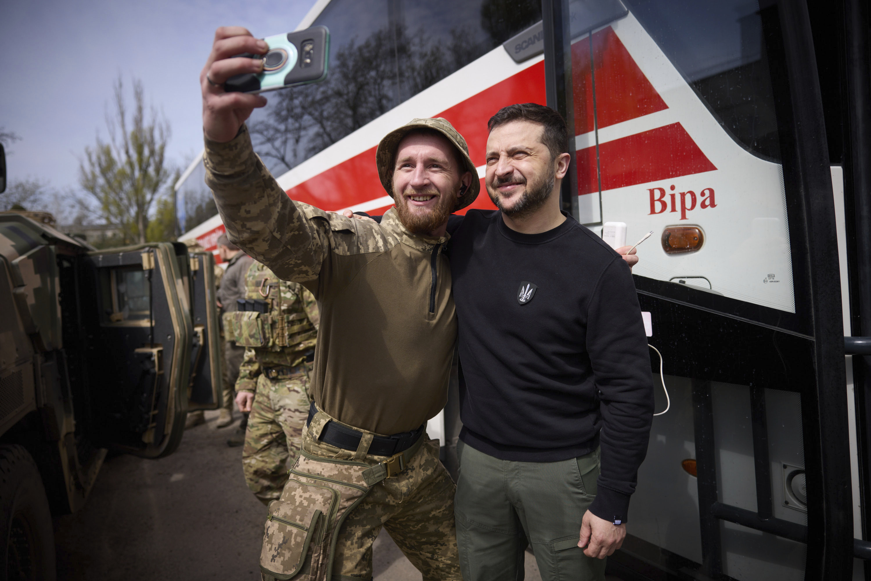 Ukrainian president Volodymyr Zelenskyy poses for a selfie with a soldier at a position in Avdiivka, Donetsk region. Photo / AP