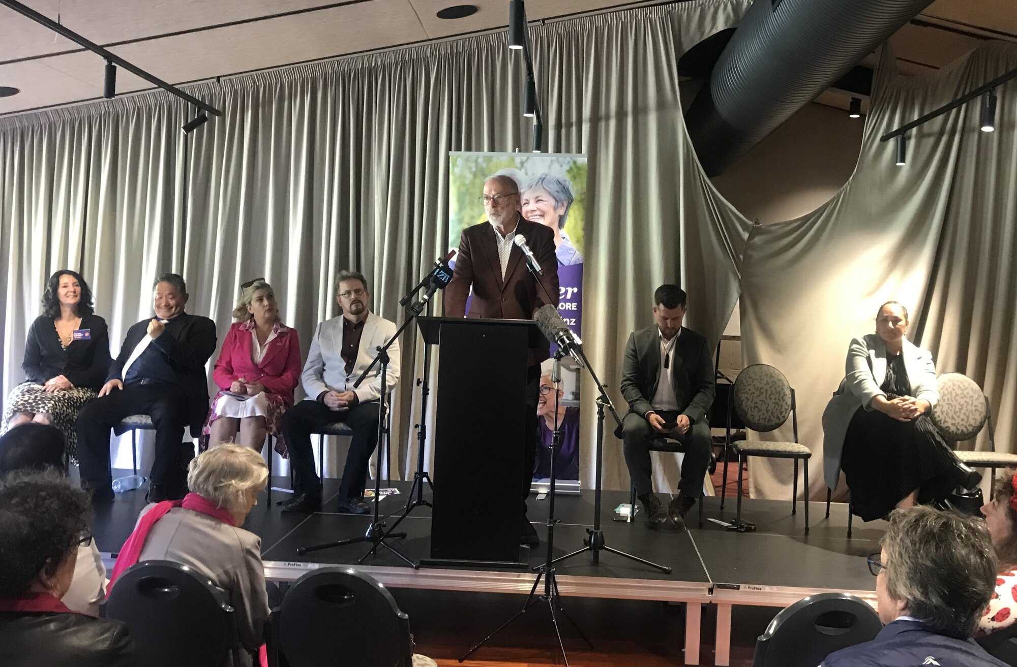 Auckland Mayor Wayne Brown speaking at the Grey Power meeting in Northcote. Kerrin Leoni is at right. Photo / Simon Wilson