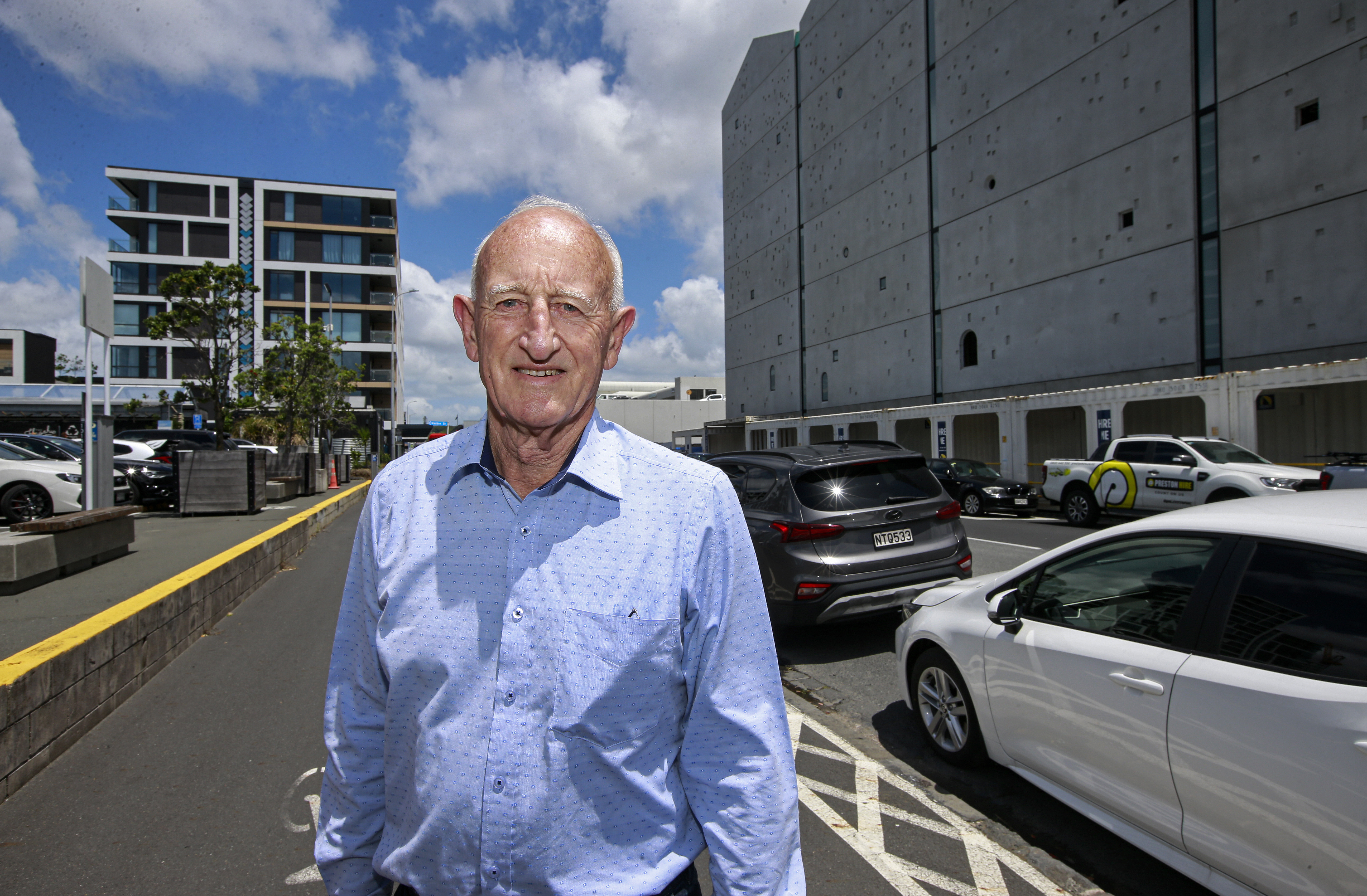 Neven Barbour, Orams Marine chief in front of the apartments (left) and new sheds. Photo / Alex Burton