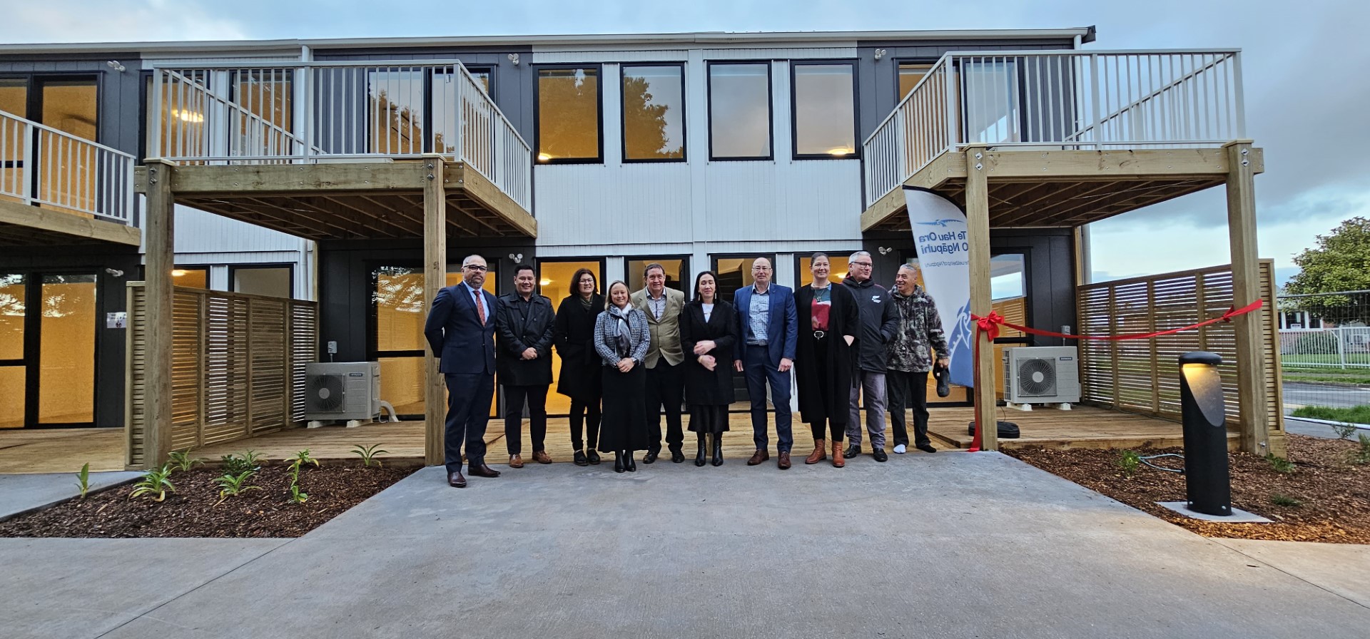 Ministers Peeni Henare, Kelvin Davis and Willow-Jean Prime with representatives from Far North Holdings Ltd and Te Hau Ora o Ngāpuhi in front of the Block A one-bedroom apartments, which will be open to new tenants at the end of the month in Kaikohe.