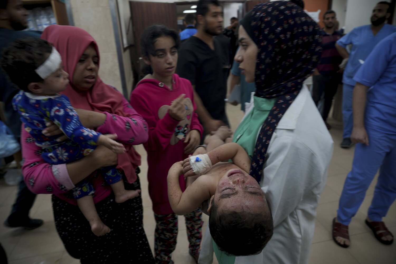Palestinians wounded in the Israeli bombardment of the Gaza Strip are brought to a hospital in Deir al-Balah on November 14. Photo / AP  