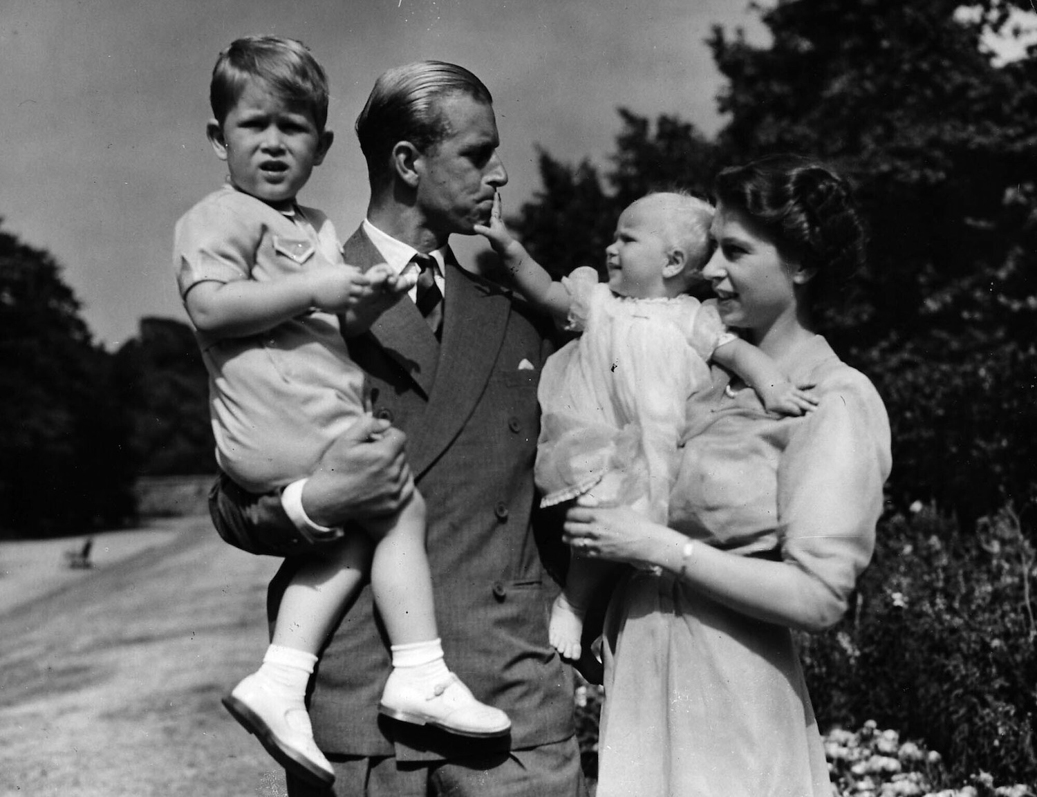Princess Elizabeth stands with her husband the Duke of Edinburgh and their children Prince Charles and Princess Anne at the couple's London residence in 1951. Photo / AP