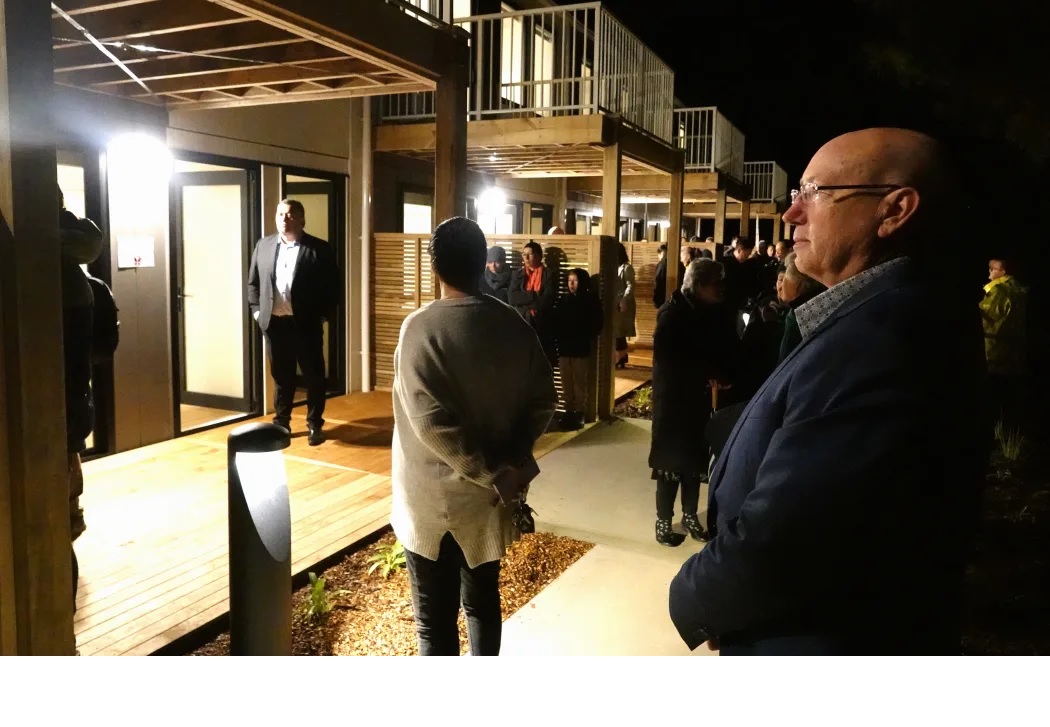 Far North Holdings chief executive Andy Nock watches as the first homes at Te Kohekohe are blessed.

-