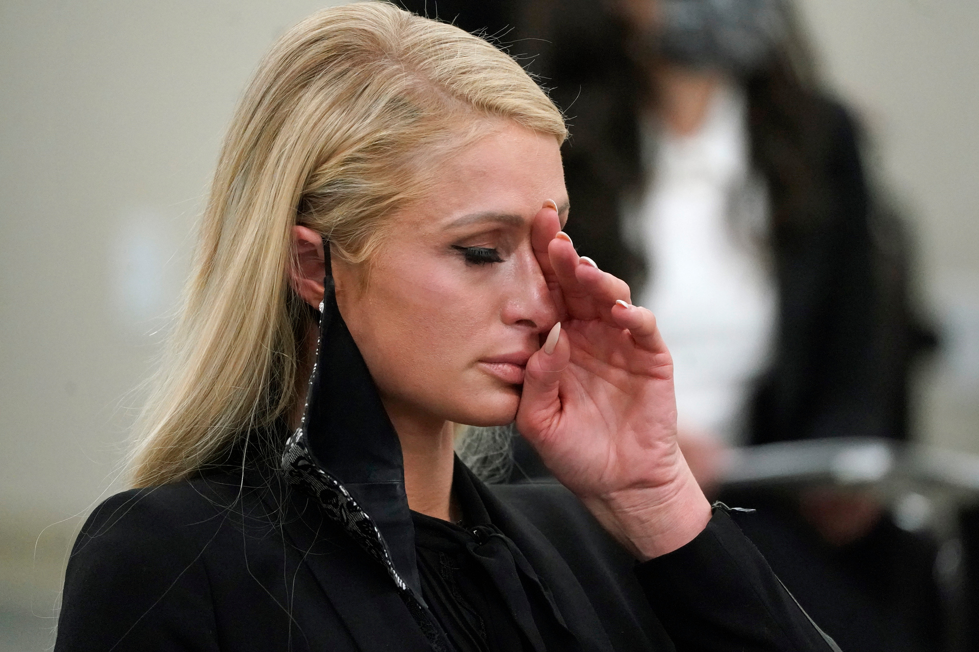 Paris Hilton wipes her eyes after giving evidence about abuse she says she suffered years ago at a boarding school in Utah. Photo / AP