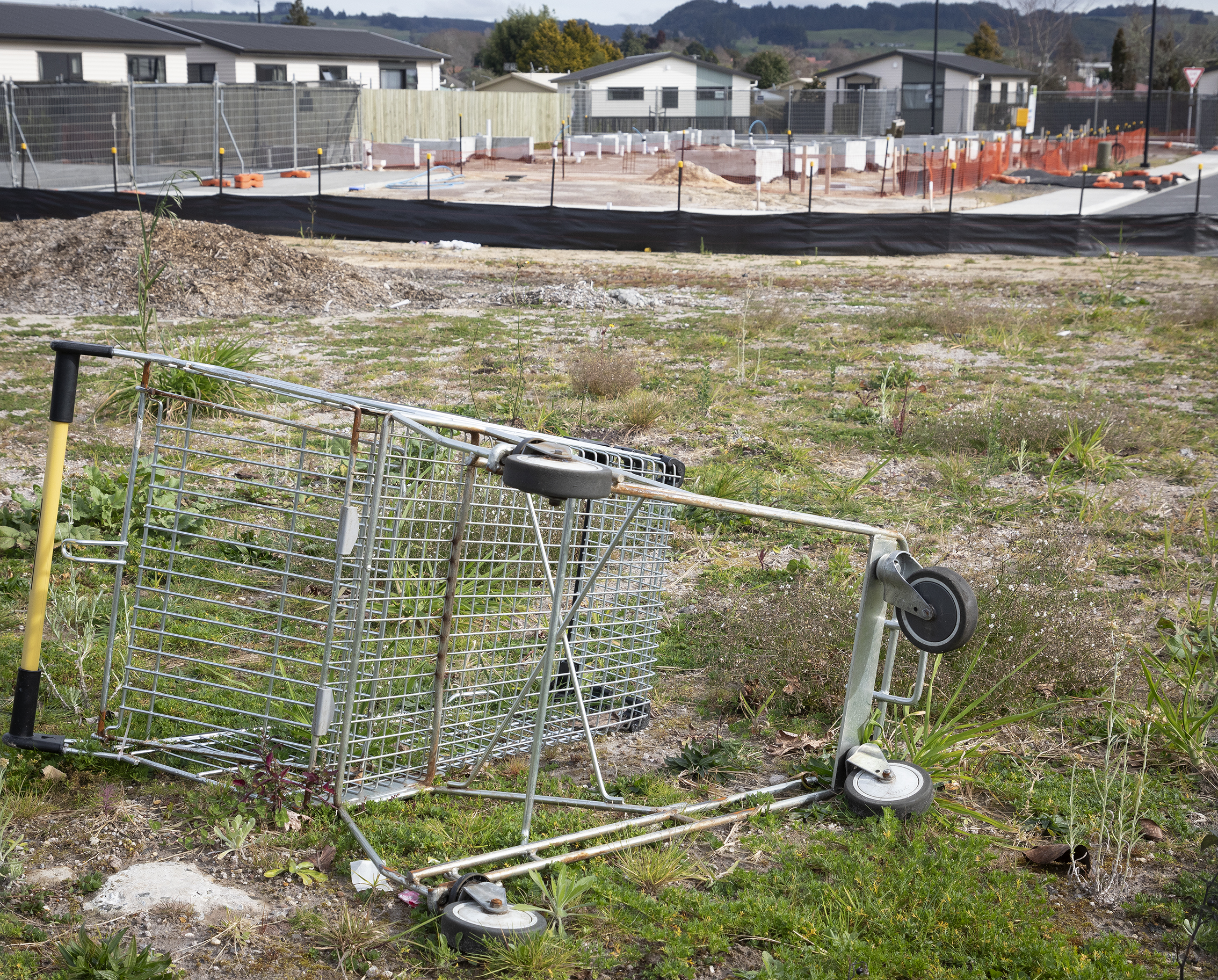 A dumped shopping trolley at the Ranolf St and Malfroy Rd housing complex. Photo / Andrew Warner