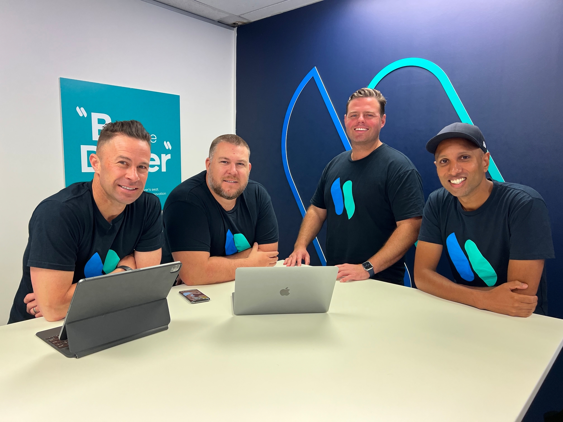 From Left: Whip Around CEO Noah Hickey, strategic partnerships VP James Colley, chief communications officer Tim Boyle and VP of engineering Shai Bhula. Photo / Supplied 