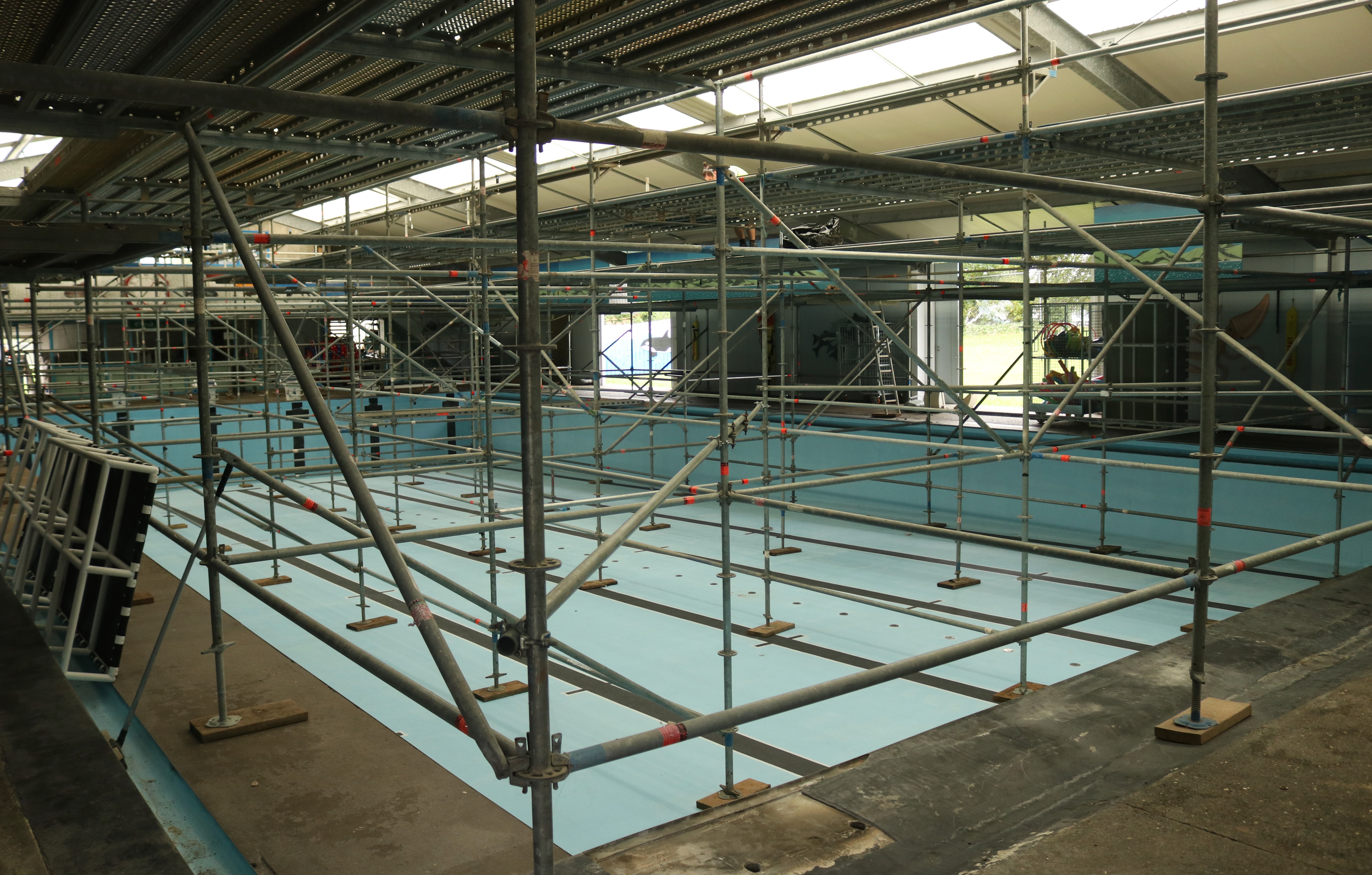 Scaffolding replaced water at Kawakawa Community Pool while a structurally unsound roof was repaired. Photo / Peter de Graaf
