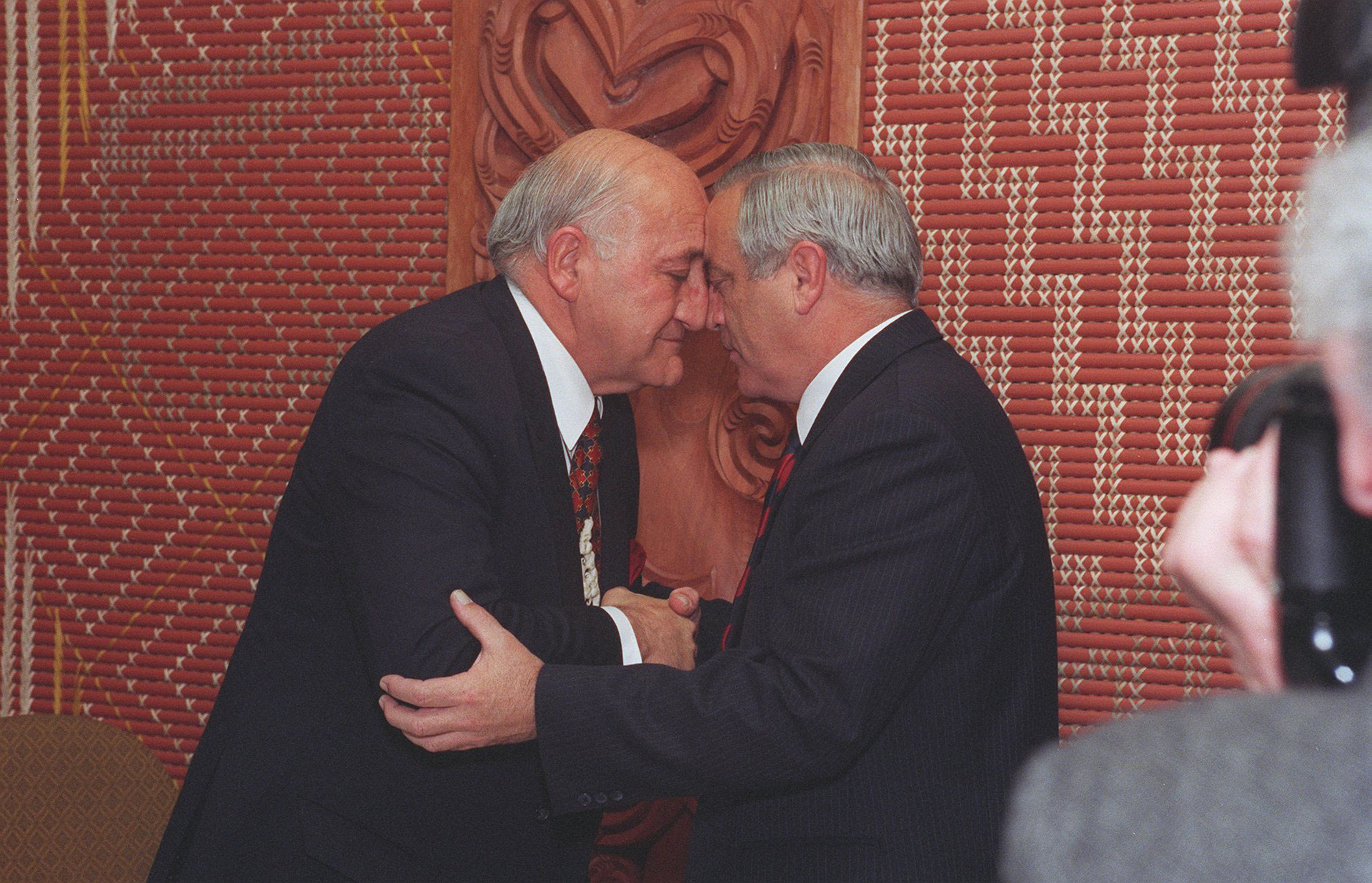Sir Tipene O'Regan accepts the Waitangi Tribunal settlement offer of $170 million from then-minister for treaty negotiations Sir Douglas Graham in Wellington, in 1997. Photo / Mark Mitchell