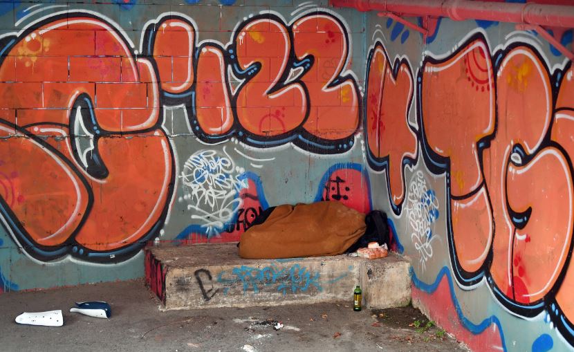 A homeless person sleeps in the basement of the Kāinga Ora building on Moray Place. Photo / Stephen Jaquiery