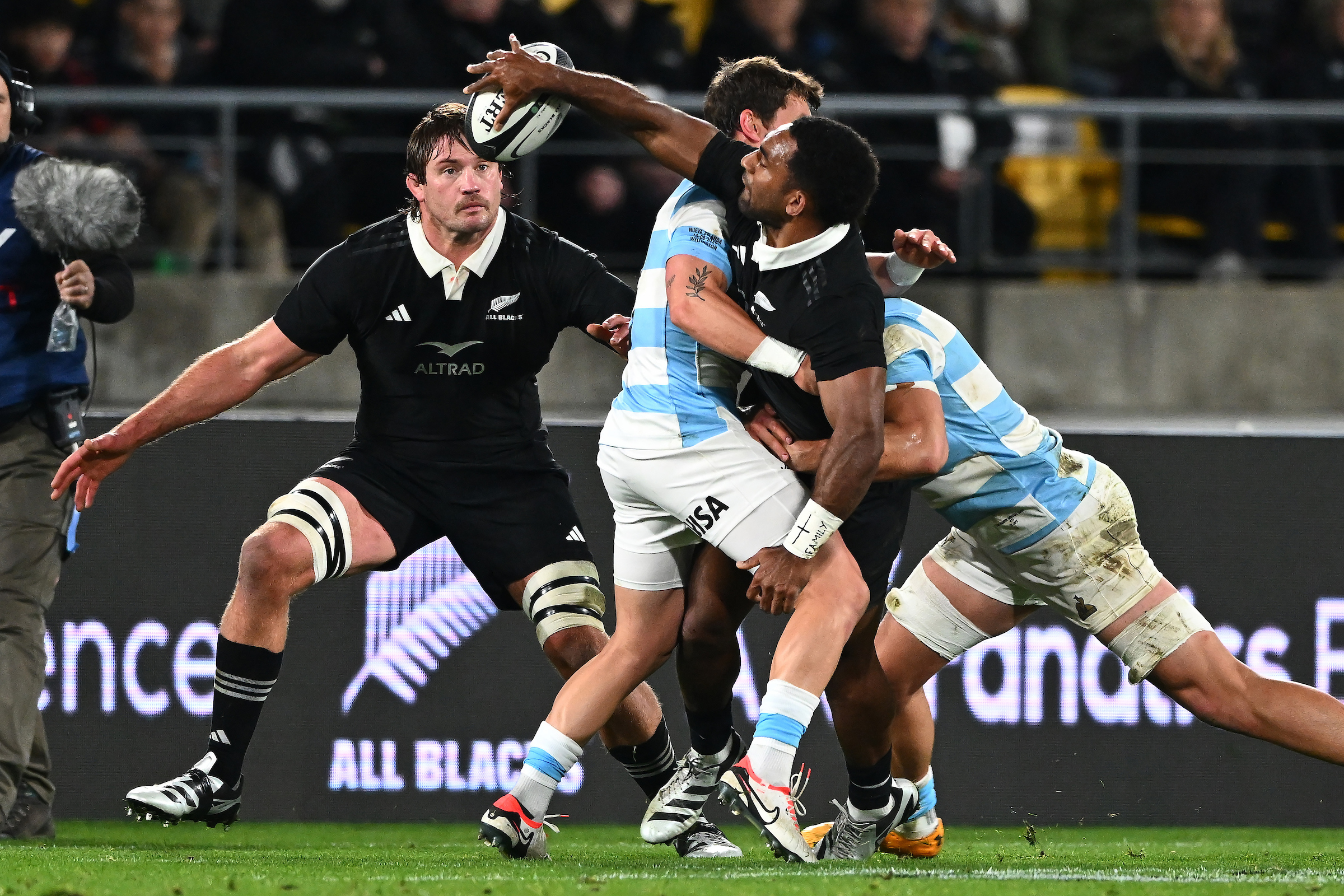 Sevu Reece offloads the ball while being tackled. Photo / Photosport