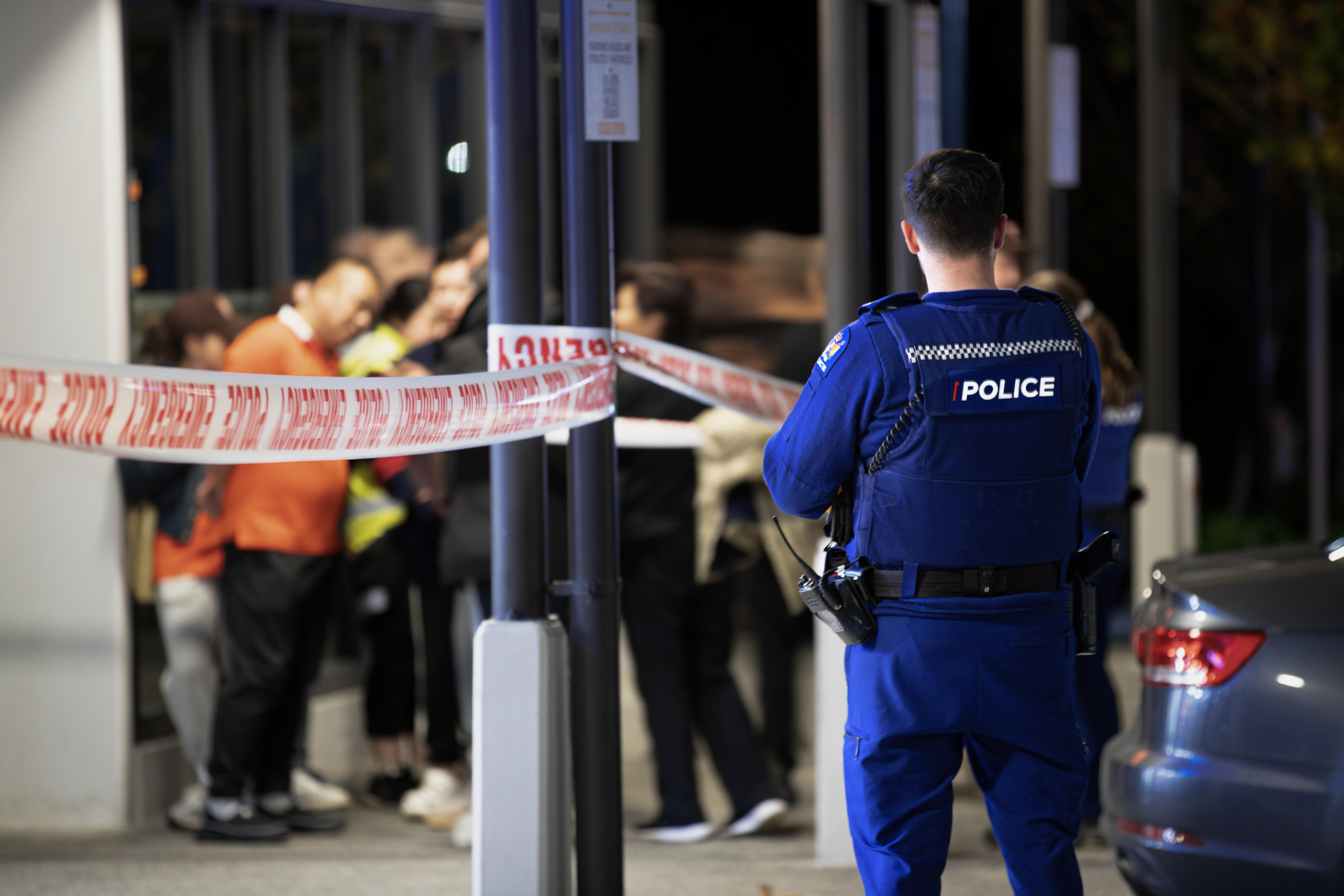 Police at the scene of a serious incident in Albany, Auckland, last night. Photo / Hayden Woodward