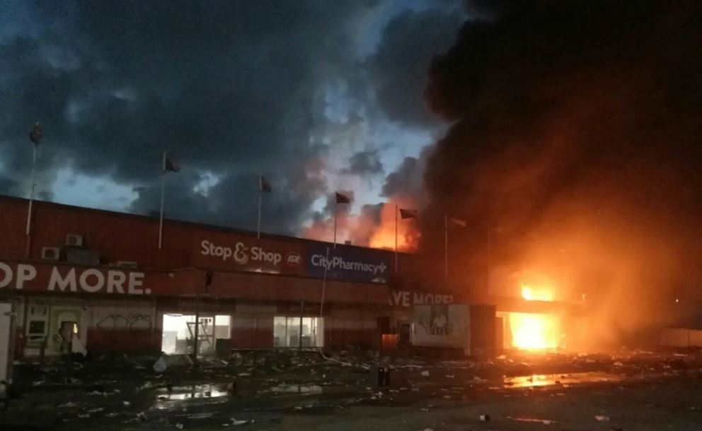 Rioting broke out as looters and opportunists took advantage of a protest by the country's police and security forces. Photo / Facebook, Isaac A Itsima