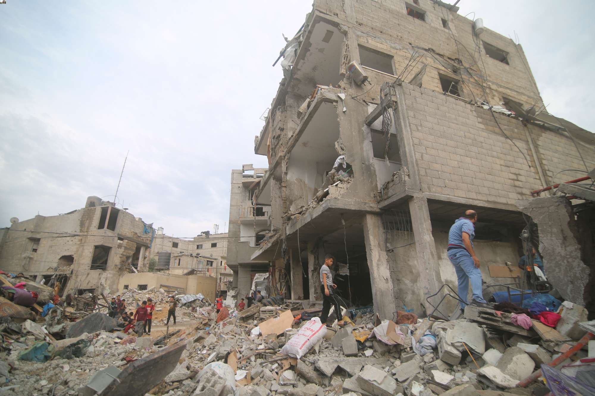 Palestinians inspect the rubble Abu Helal family in Rafah refugee camp in Gaza Strip. Photo / AP