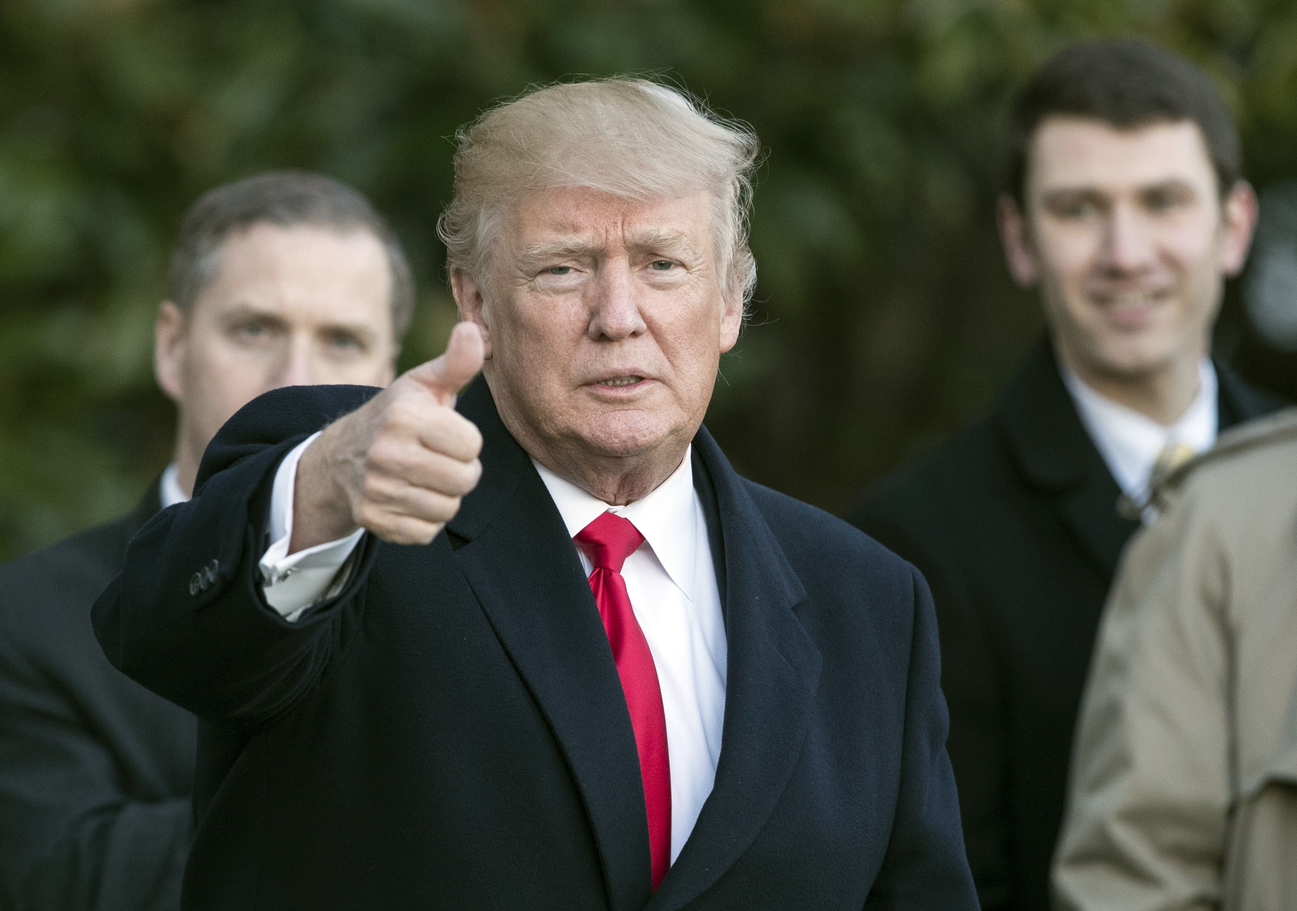 President Donald Trump gives the thumbs-up as he arrives on Marine One at the White House in Washington. Photo / AP