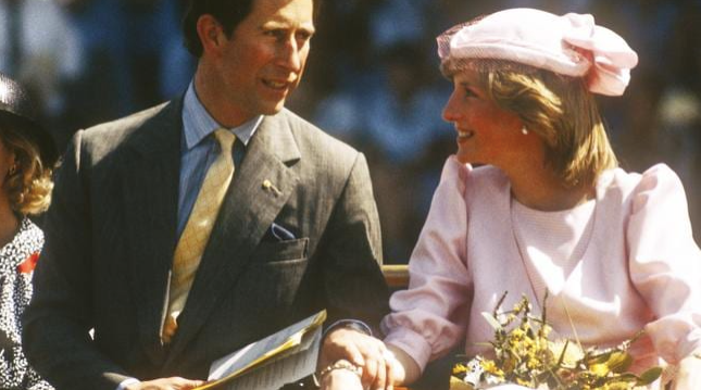 A rare public display of affection between Charles and Diana during their 1983 tour of Australia. Photo / Getty Images

