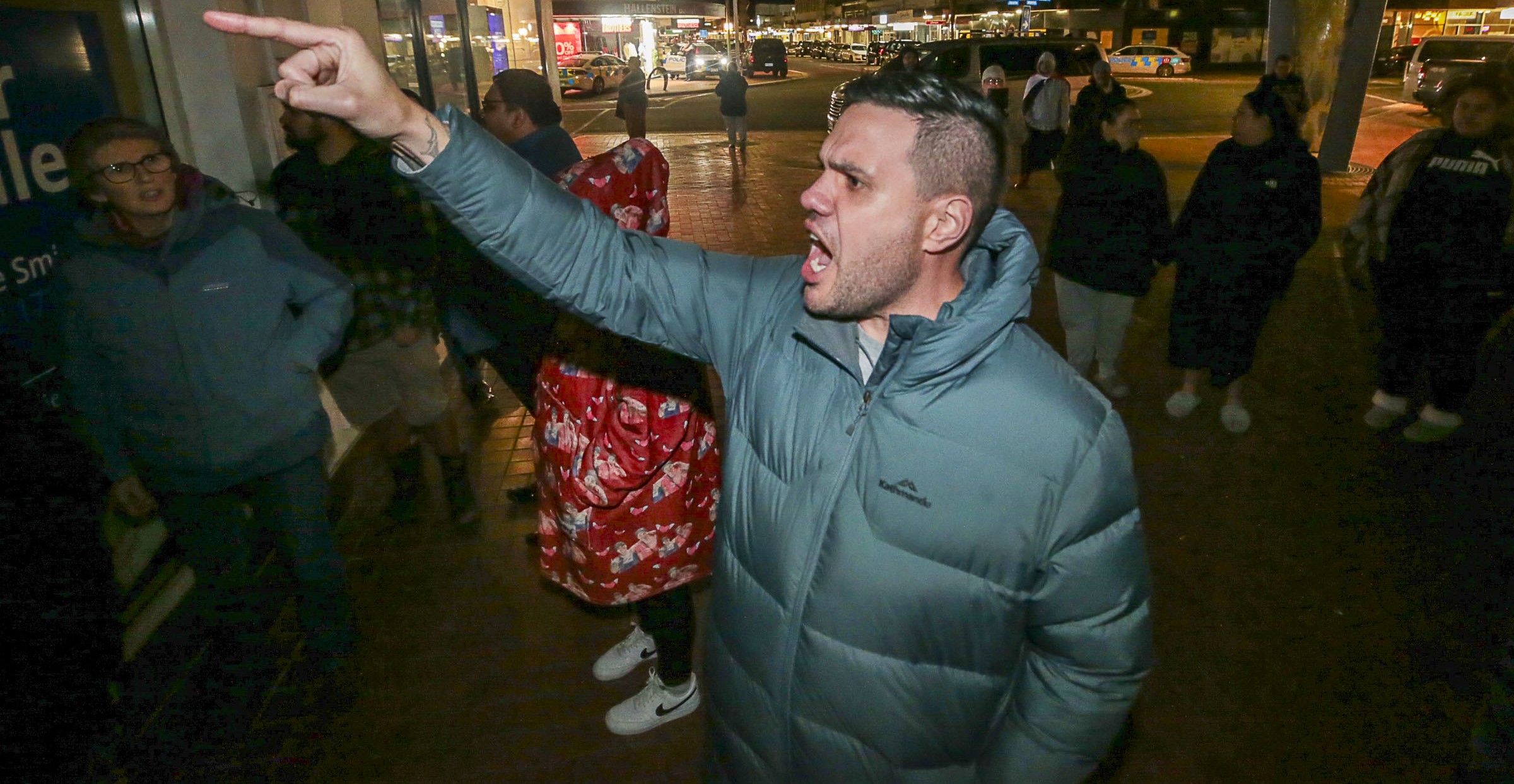 Jeremy Tātere MacLeod protests the Stop Co-Governance meeting in the Hastings CBD on Monday night. Photo / Paul Taylor