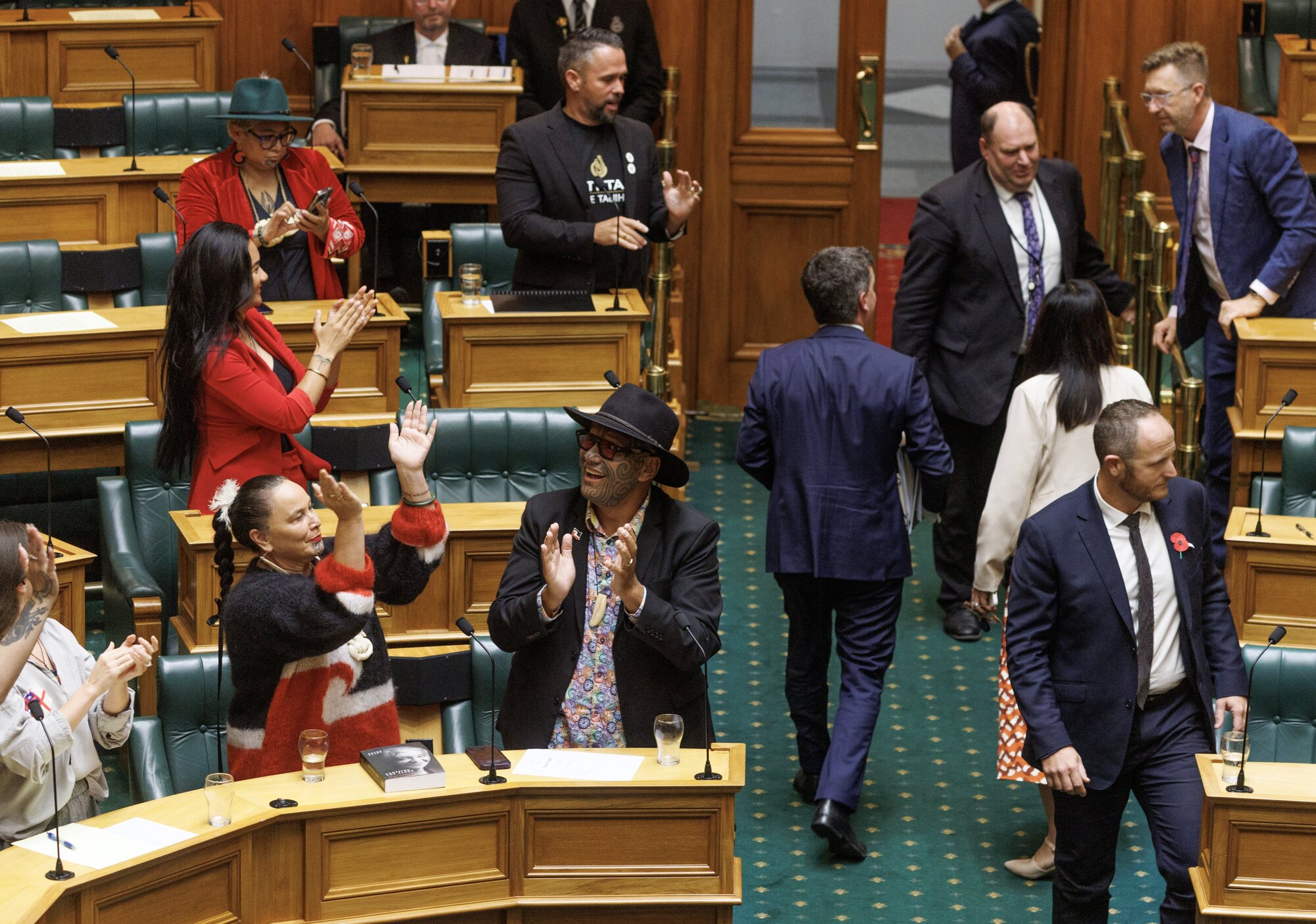 Opposition MPs celebrate as Act leader David Seymour leaves the House after the Treaty Principles Bill was voted down. Photo / Mark Mitchell