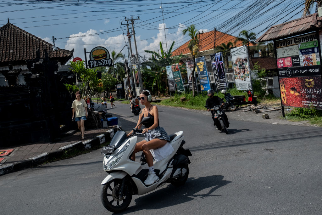 Bali leaders and authorities are sick of tourists not obeying their laws and local customs, such as riding a motorcycle without a helmet. Photo / Agunng Parameswara, Getty Images