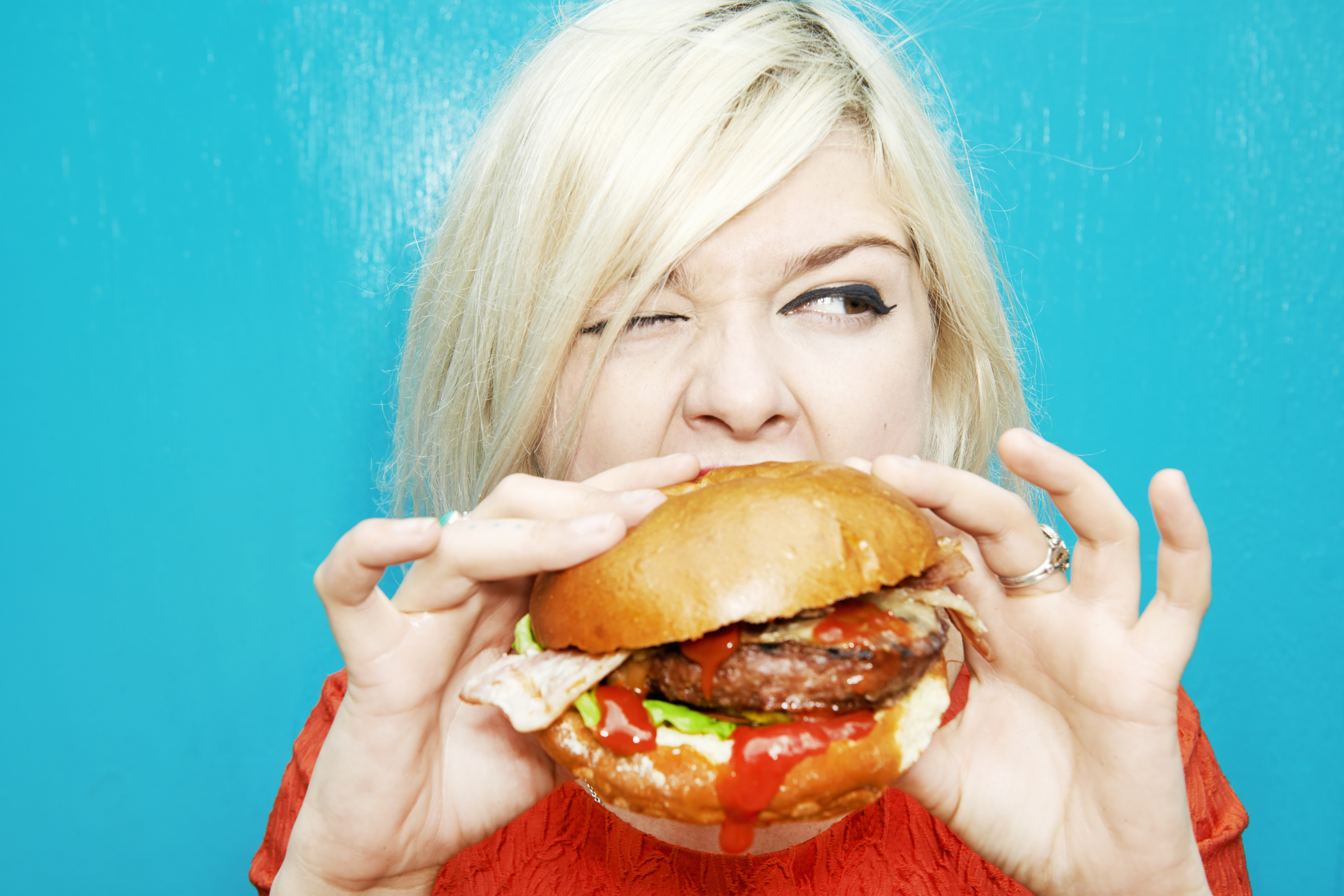 Our easy access to junk food means we're inclined to eat it whether we're actually hungry or not. Photo / Getty