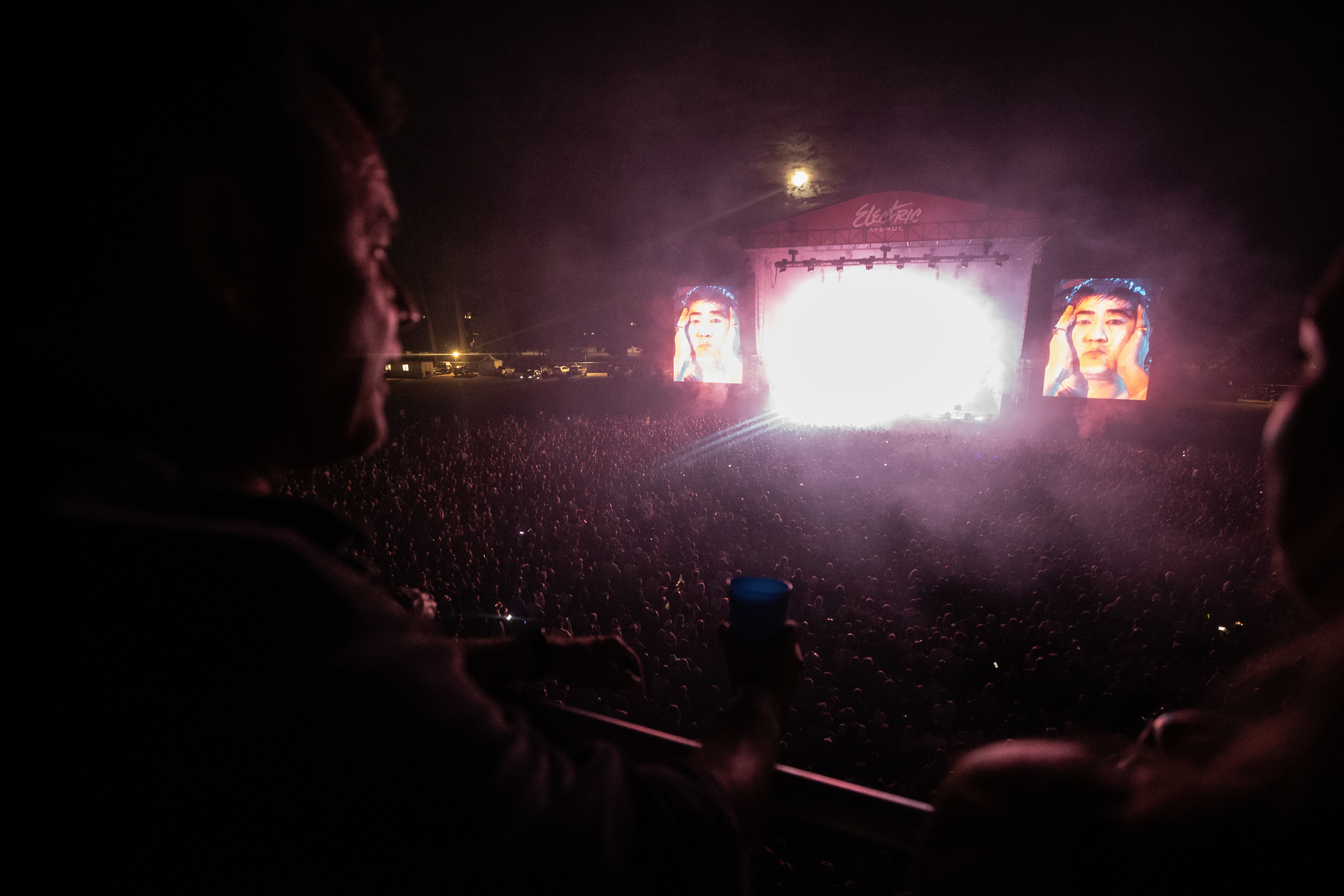 Festival director Callam Mitchell watches his headline act The Chemical Brothers. Photo / George Heard