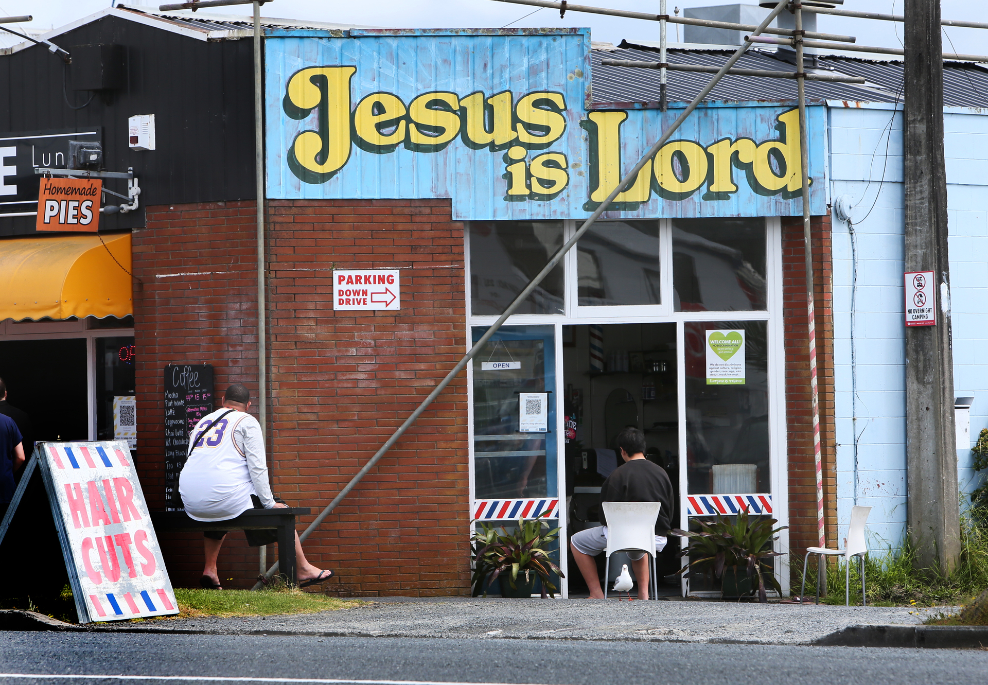 A barbershop on Port Rd is operating without the My Vaccine Pass system. Barbers cannot operate legally without it in red under the new traffic light system. Photo / Tania Whyte