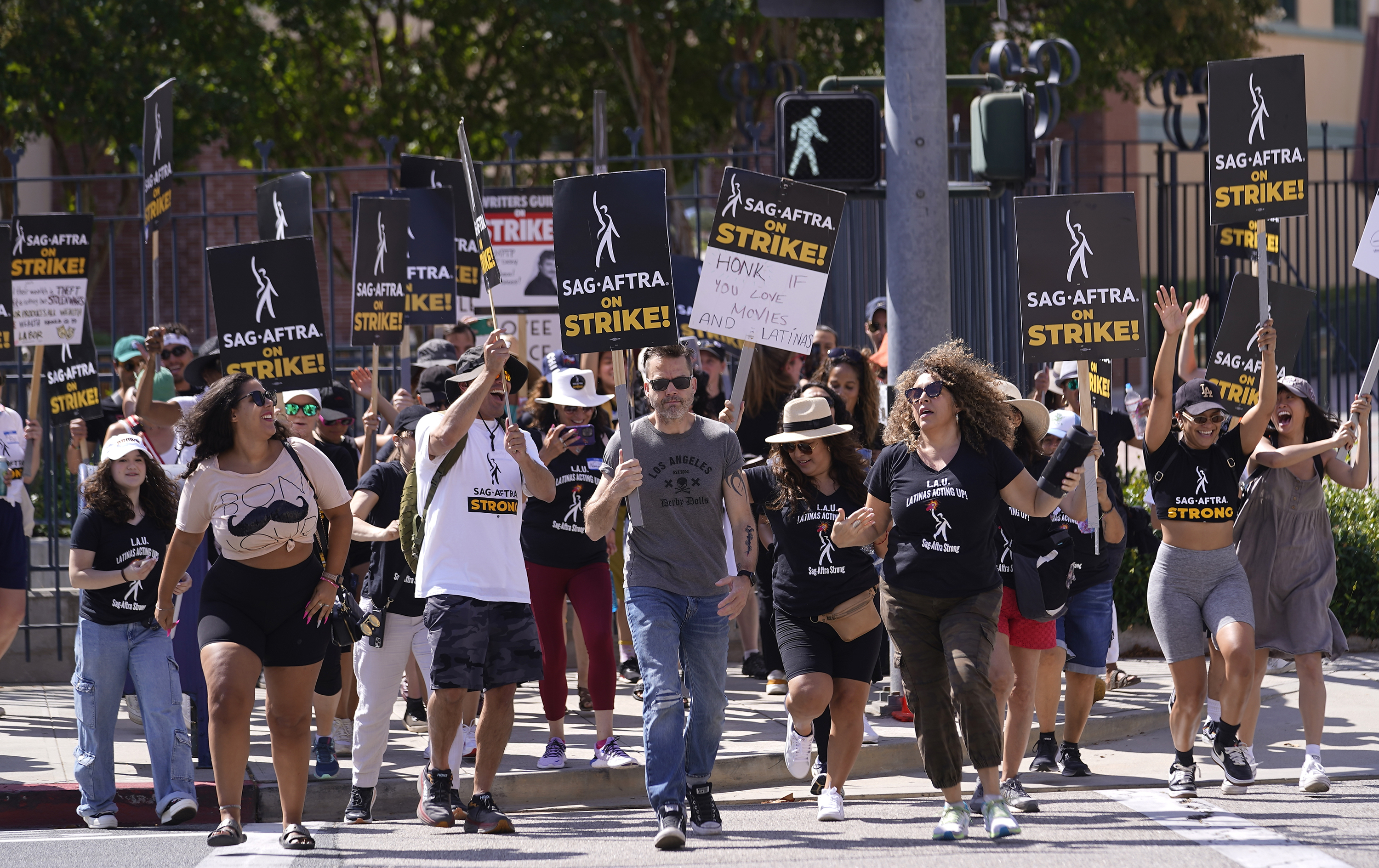 Picketers demonstrate on a line outside Disney studios in Burbank, California. Photo / AP