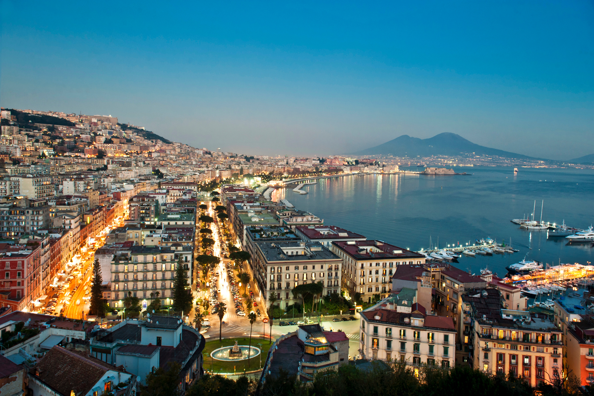 The seaside city boasts historic cafes, a grand Royal Palace, and a world-leading museum with artefacts from nearby Pompeii. Photo / Getty Images