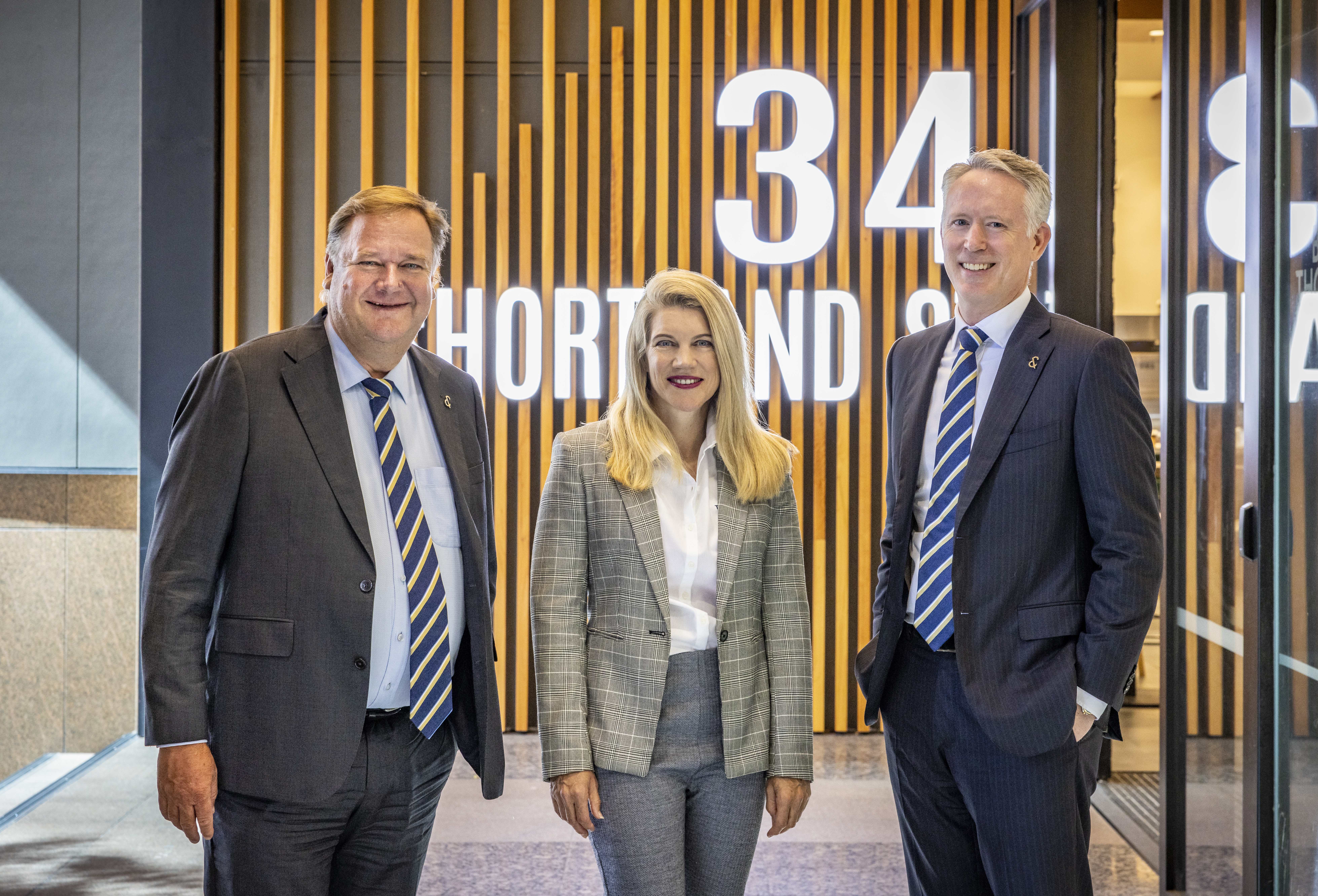 Peter Thompson, Kiri Barfoot and Stephen Barfoot at the agency's headquarters on Shortland St.