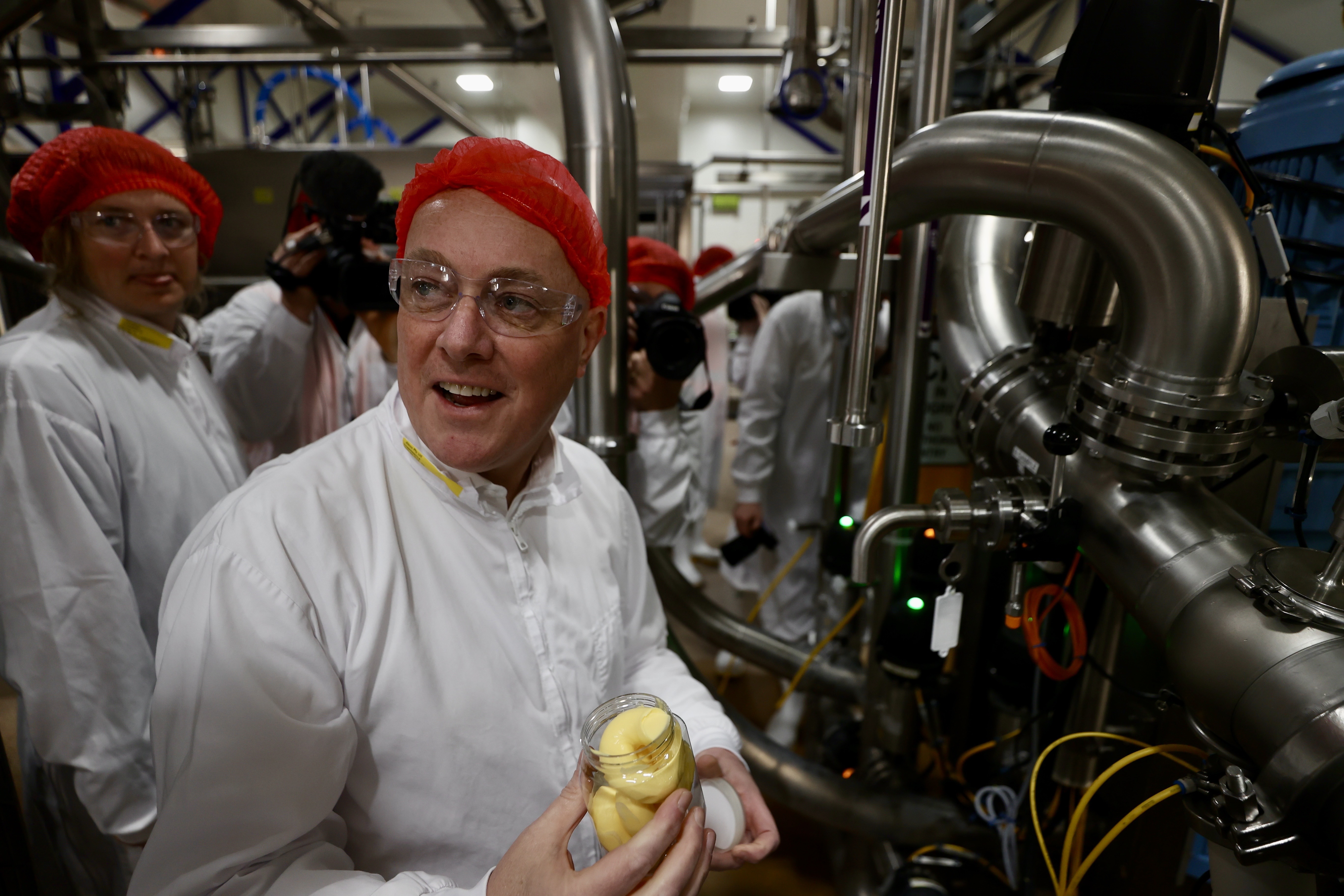 A very happy Christopher Luxon with a jar of butter. Photo / George Heard
