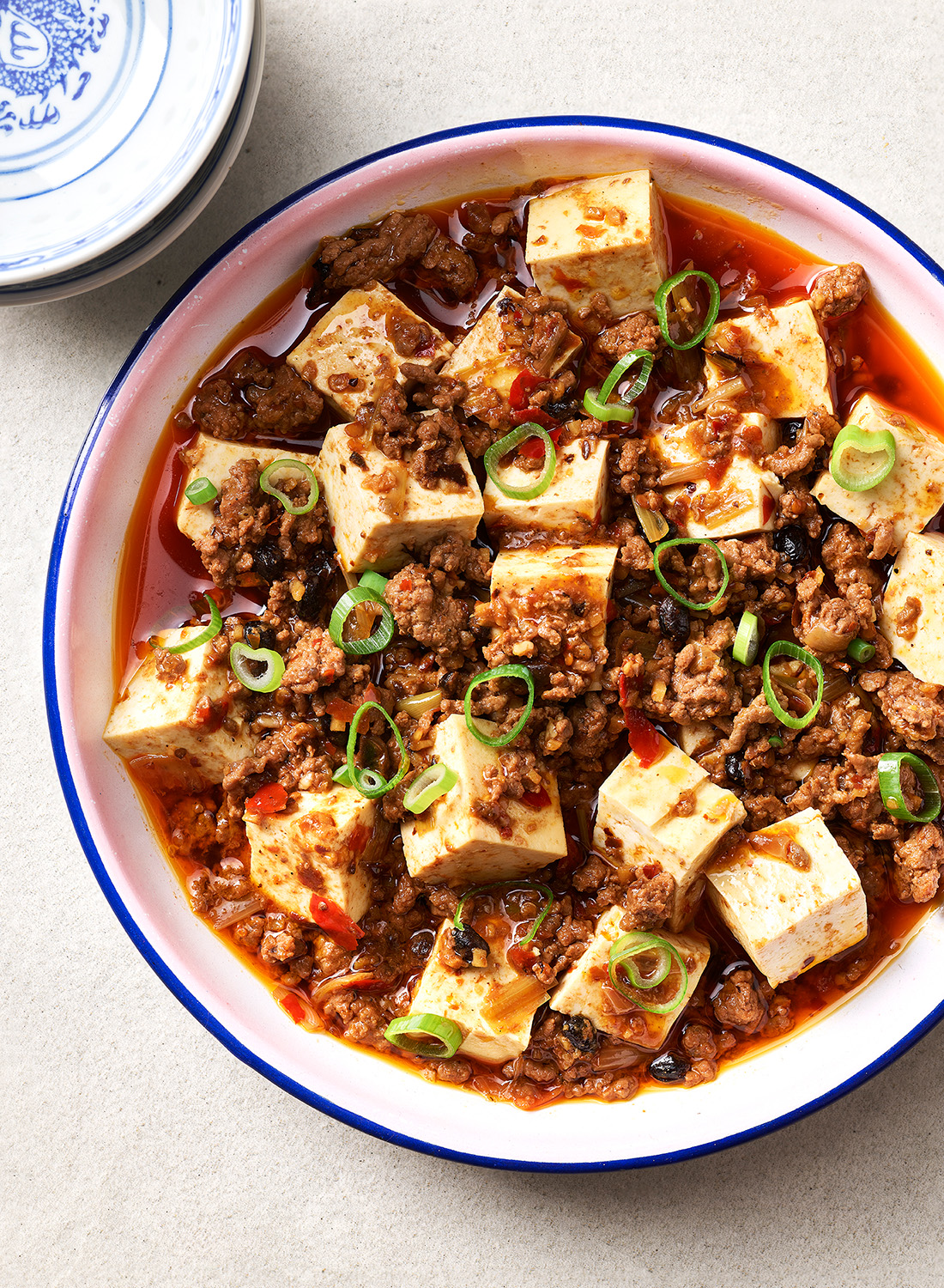 A garnish of spring onion adds a vibrancy to this chilli-soaked dish. Photo / Melanie Jenkins