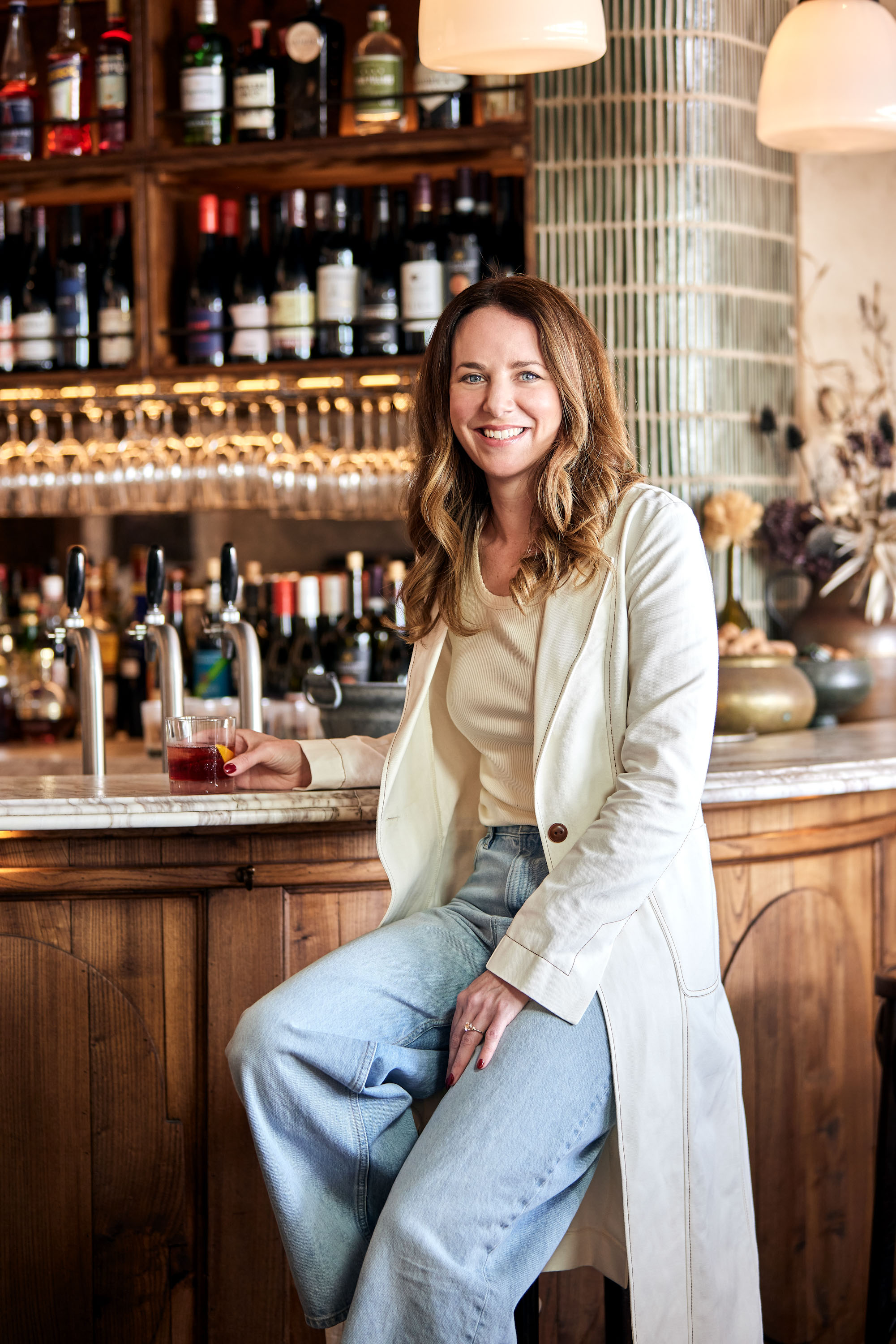 Ice-cold cocktails have been on the menu this summer, says Johanna Thornton, deputy editor for Lifestyle Premium, pictured at Lilian with a negroni. Photo / Babiche Martens